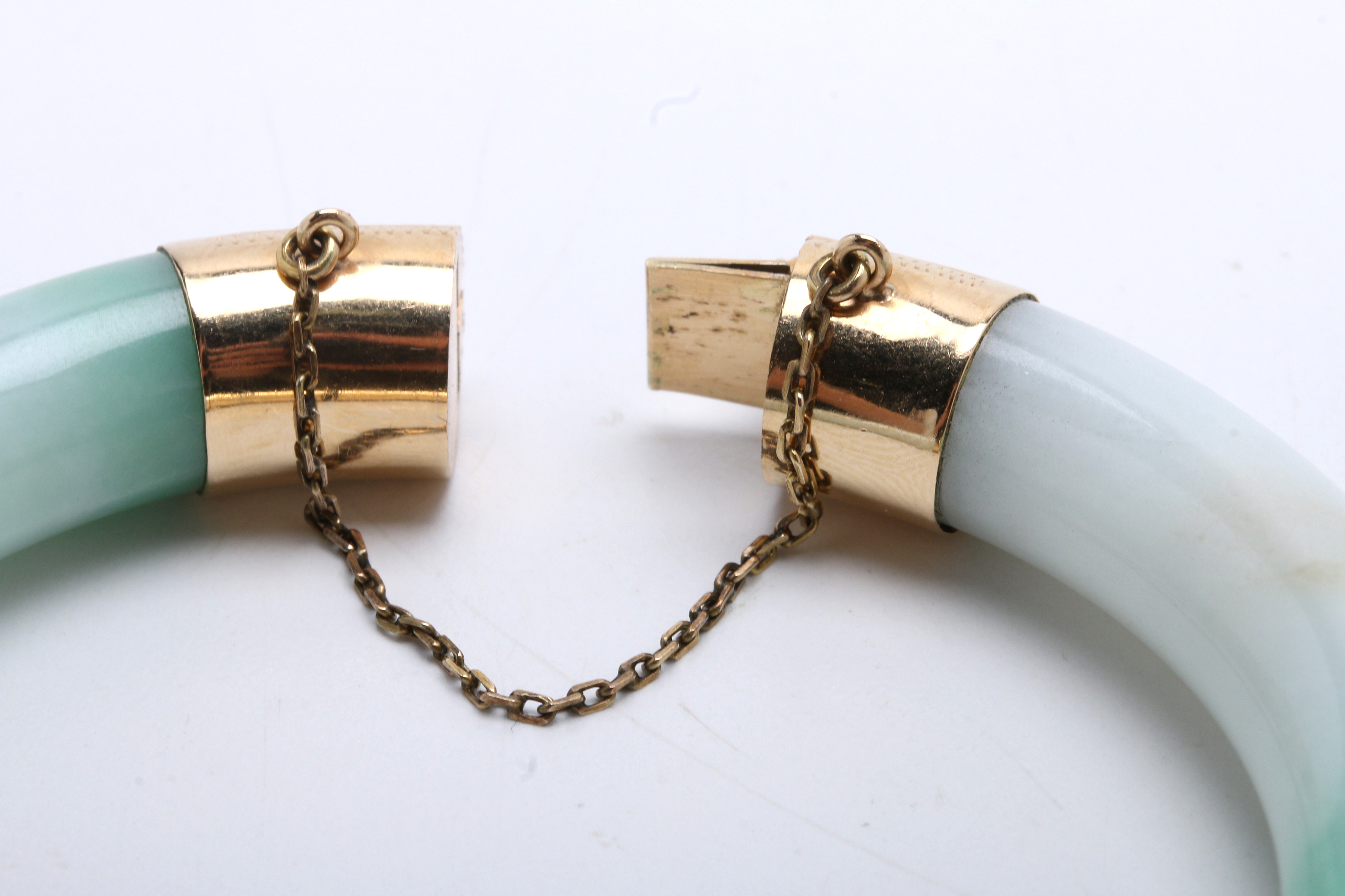 Jadeite Bracelet with 14K Yellow Gold Bands at Hinge and Clasp