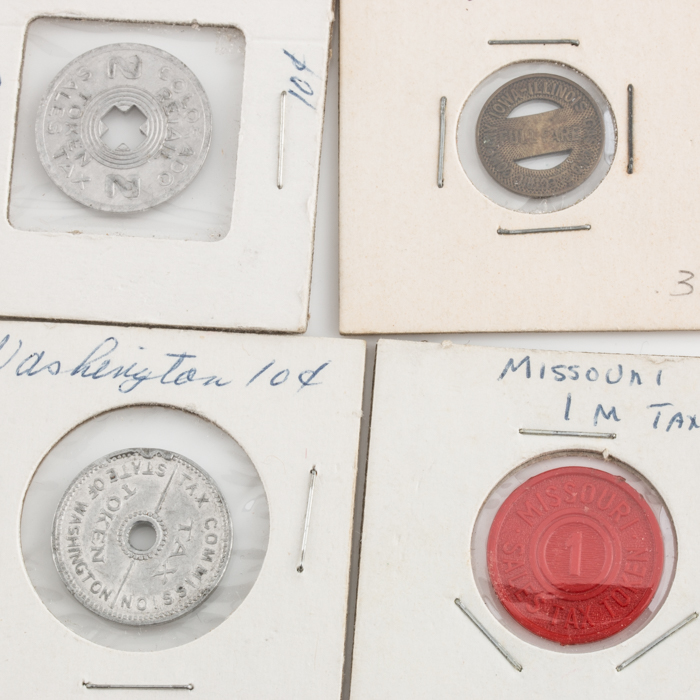 Group of Thirty-Four Tax and Transportation Tokens