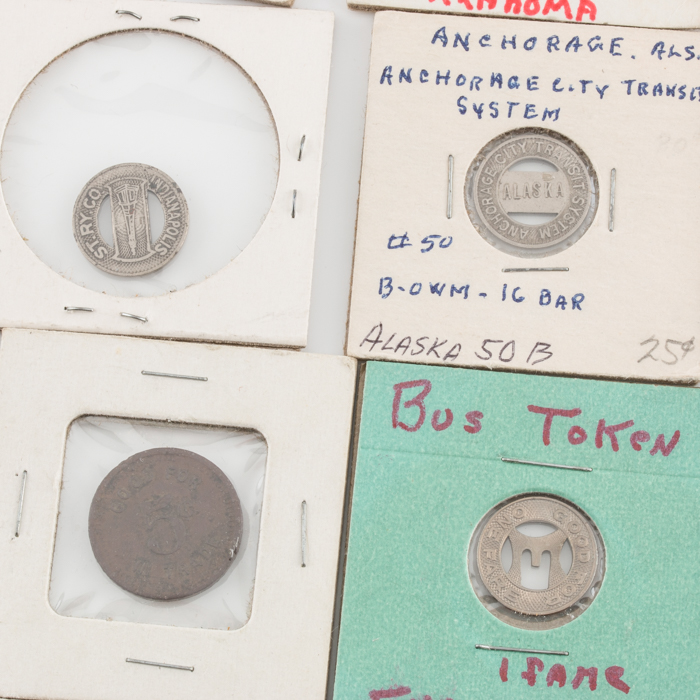 Group of Thirty-Four Tax and Transportation Tokens