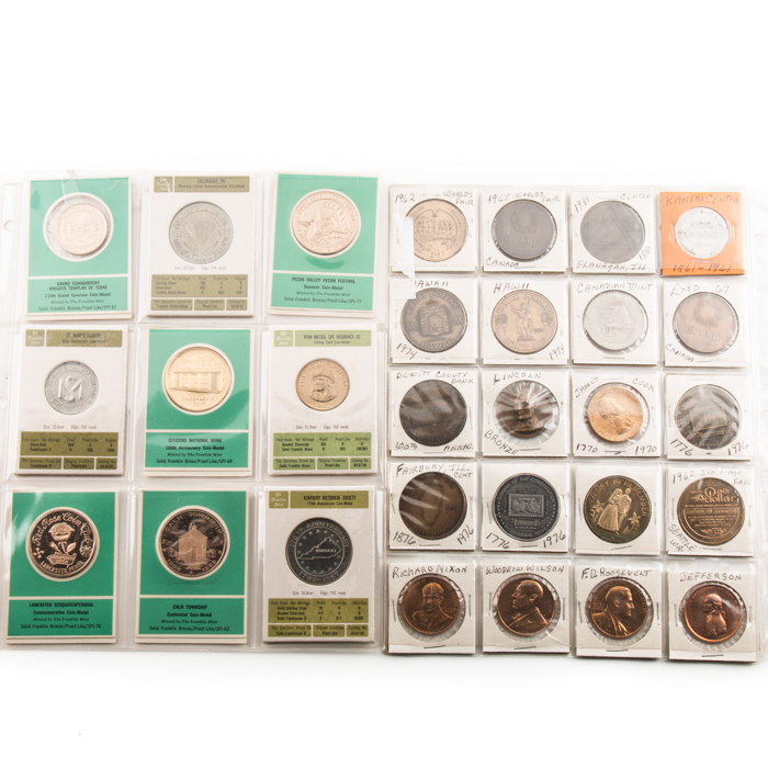 Two Album Pages of Commemorative Coins and Medals