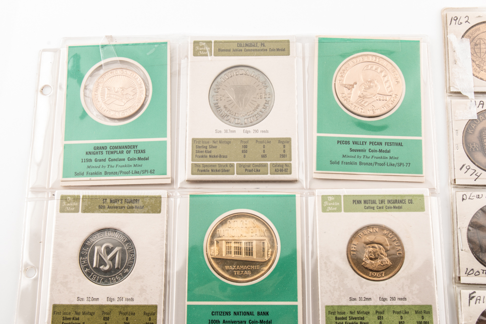 Two Album Pages of Commemorative Coins and Medals
