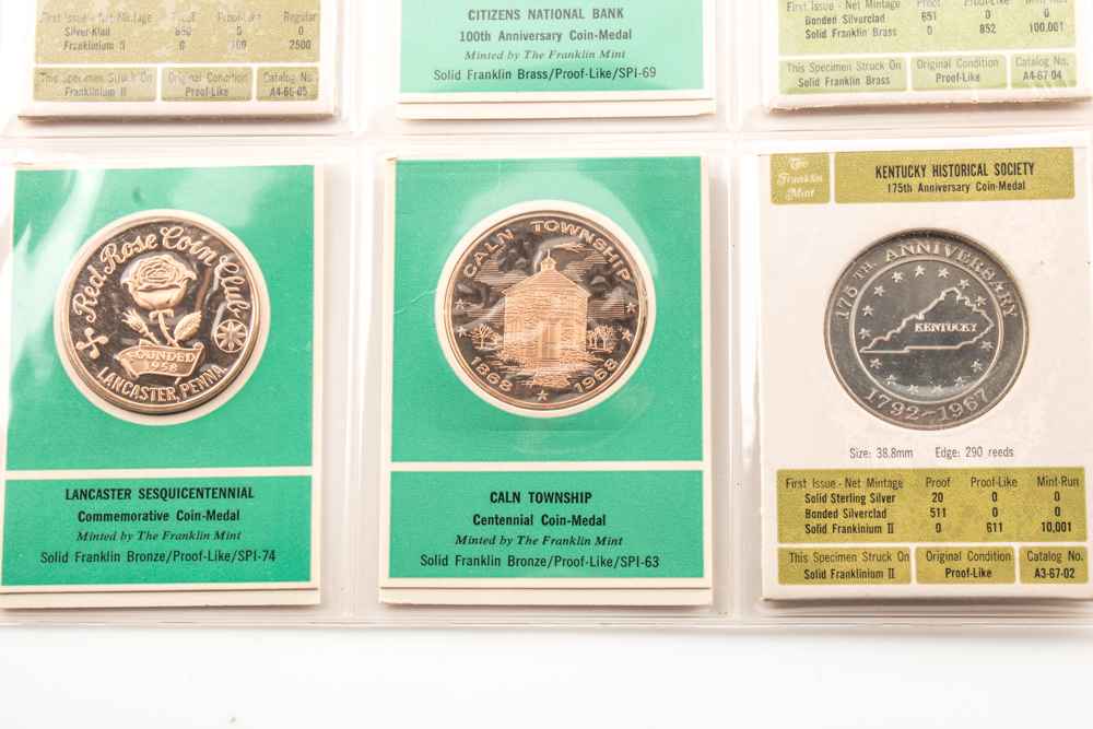 Two Album Pages of Commemorative Coins and Medals