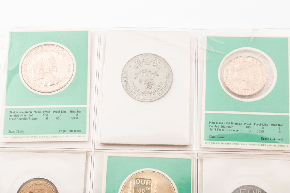 Two Album Pages of Commemorative Coins and Medals