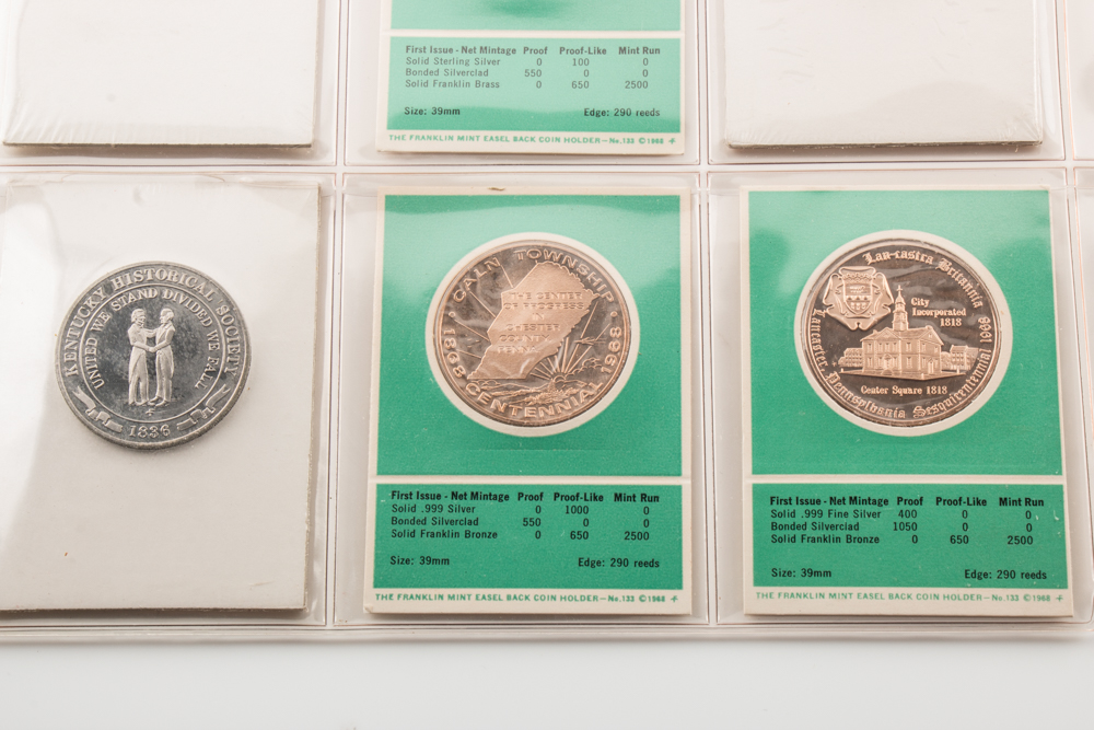 Two Album Pages of Commemorative Coins and Medals