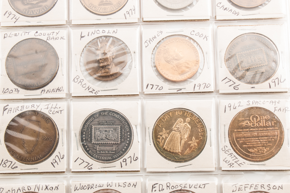 Two Album Pages of Commemorative Coins and Medals