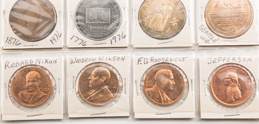 Two Album Pages of Commemorative Coins and Medals