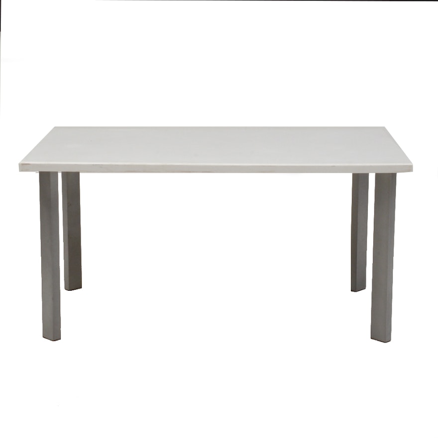 Table With White Top and Gray Metal Legs