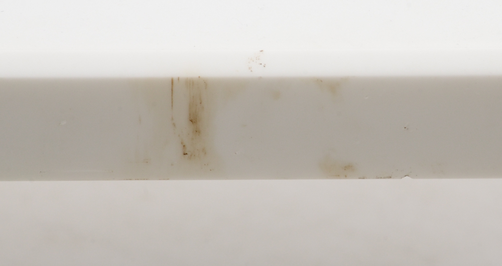 Table With White Top and Gray Metal Legs