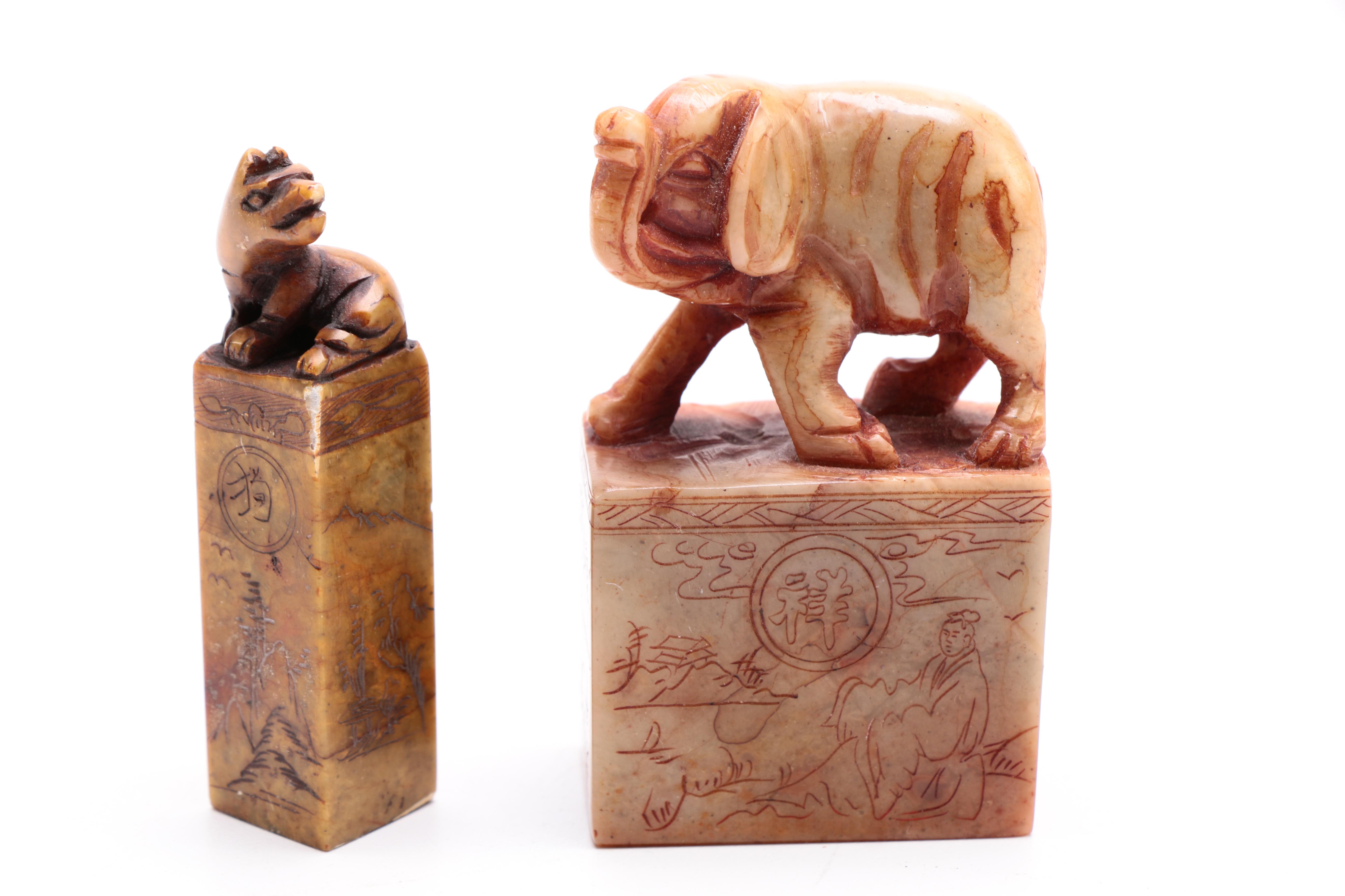 A Selection of Animal Themed Decor to Include Two Soapstone Carvings