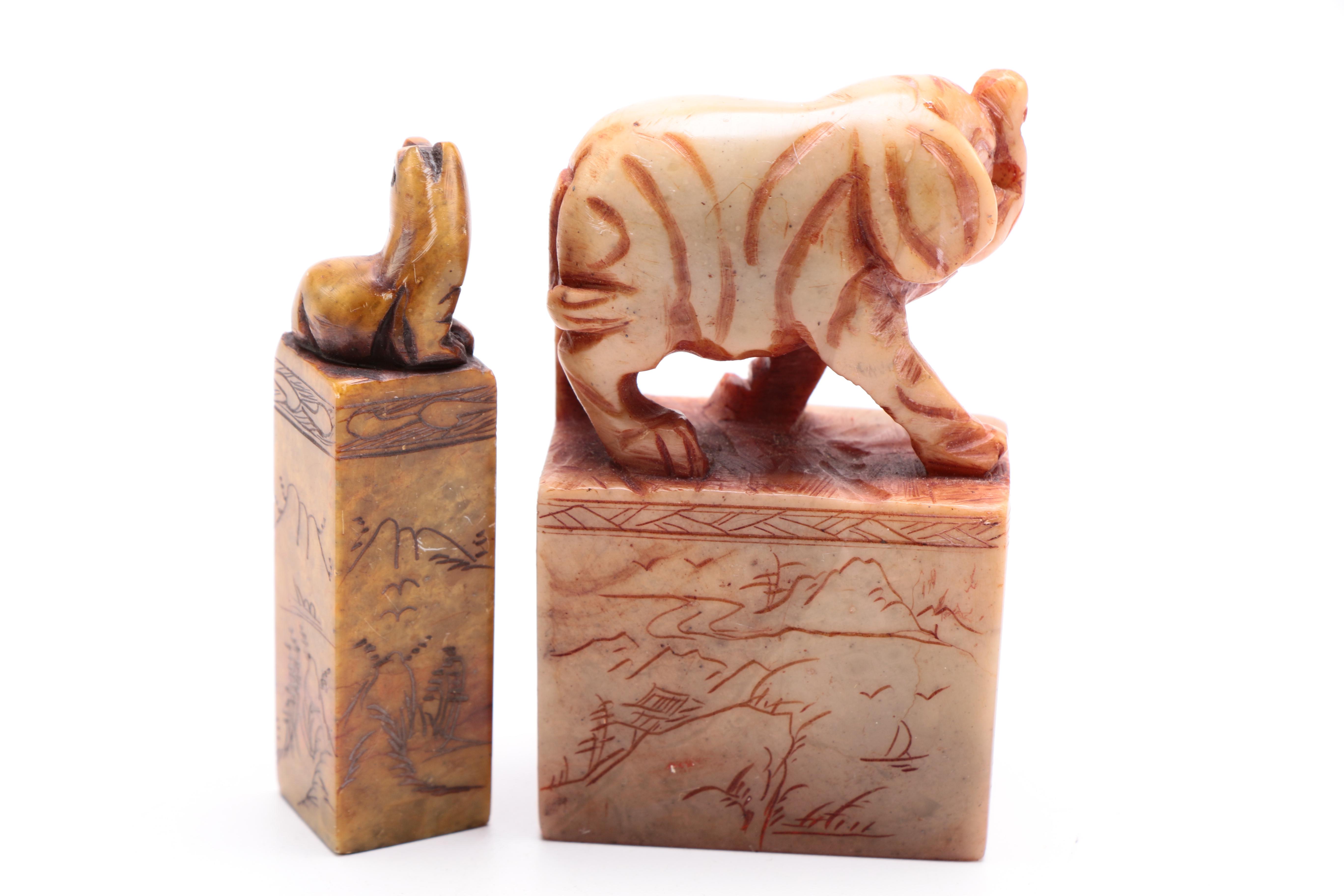 A Selection of Animal Themed Decor to Include Two Soapstone Carvings