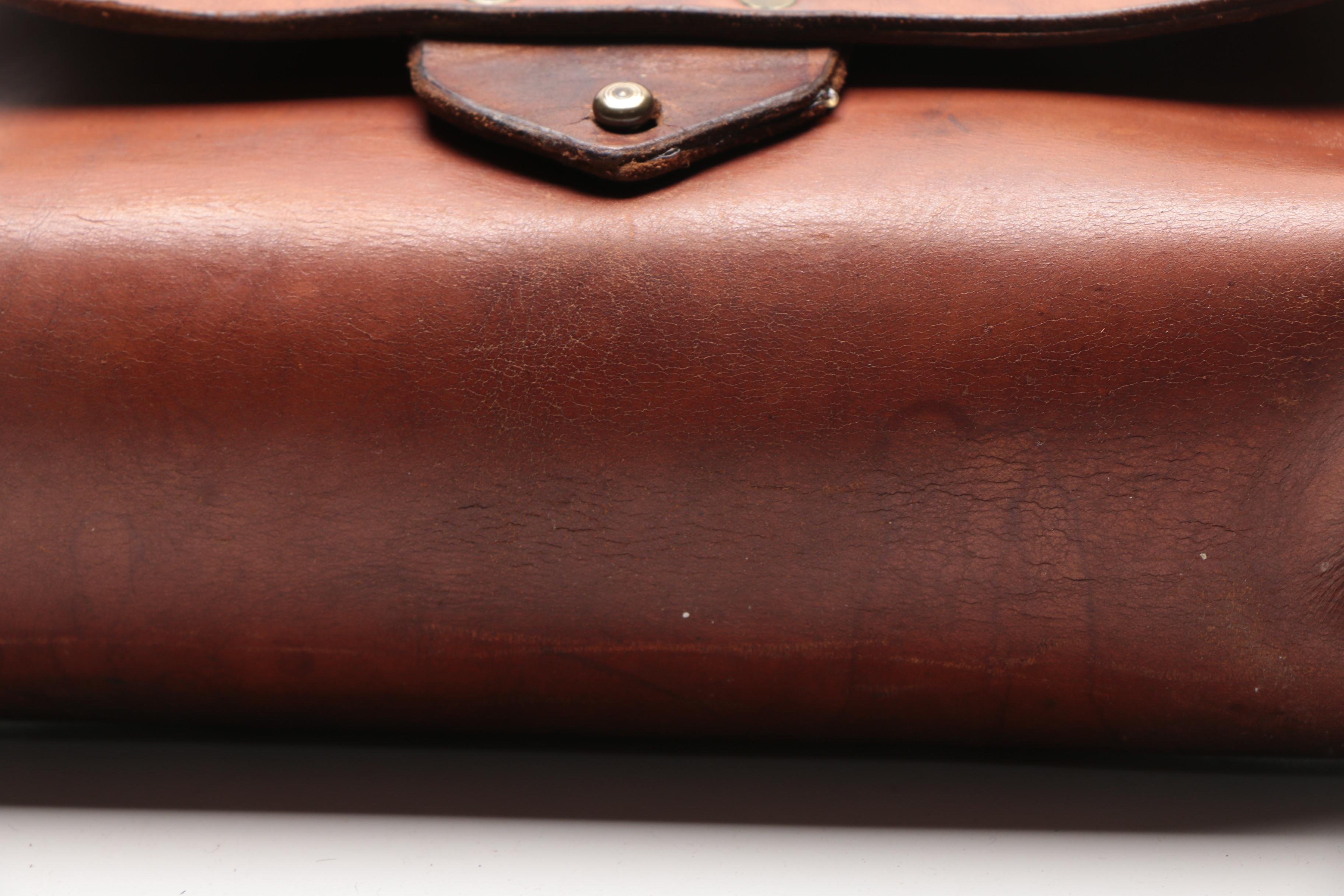 Leather Handbag with Embossed Face and Wrought Iron Handle