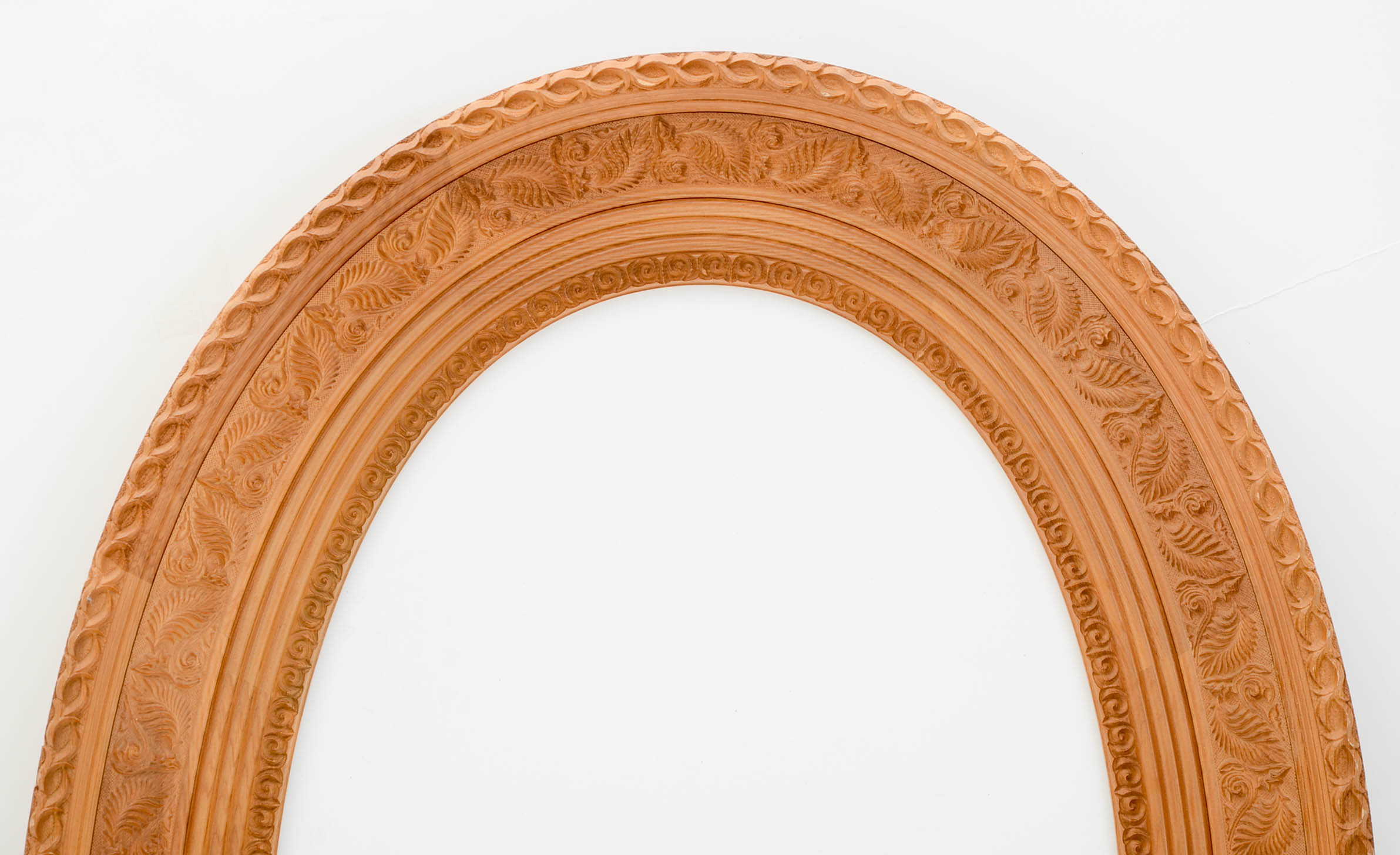 Deeply Carved Wooden Oval Frame