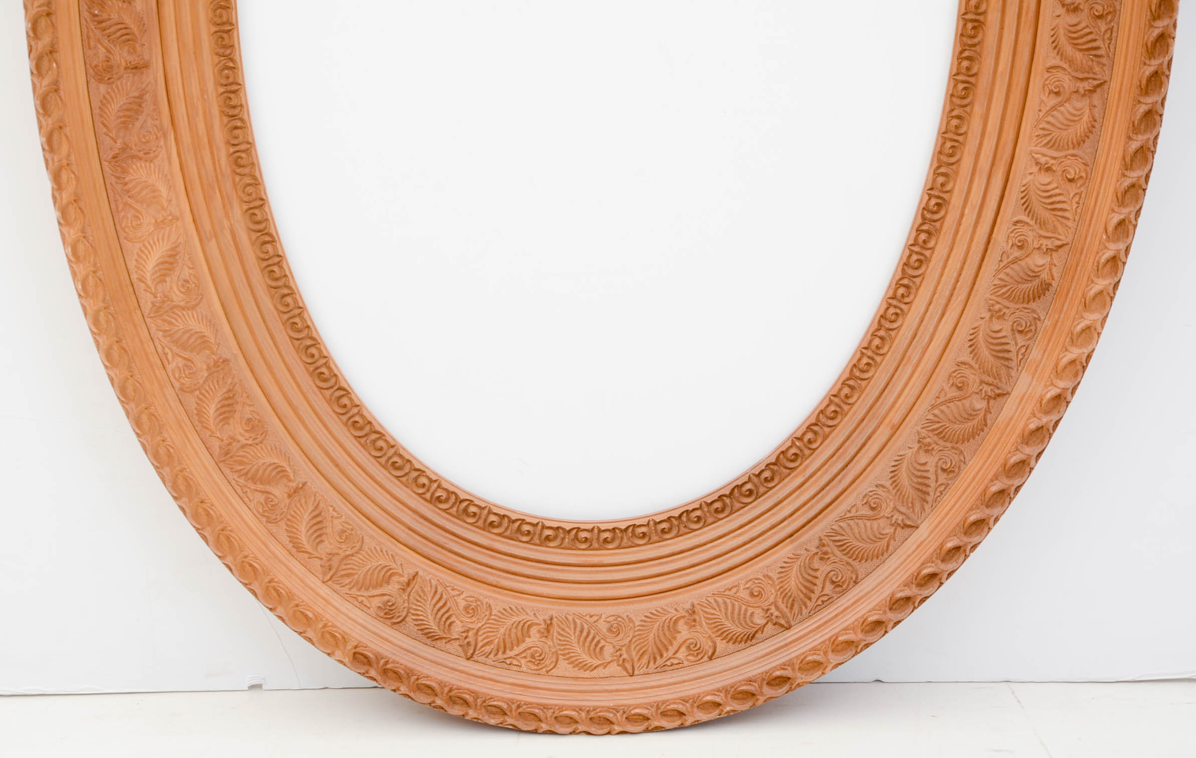 Deeply Carved Wooden Oval Frame