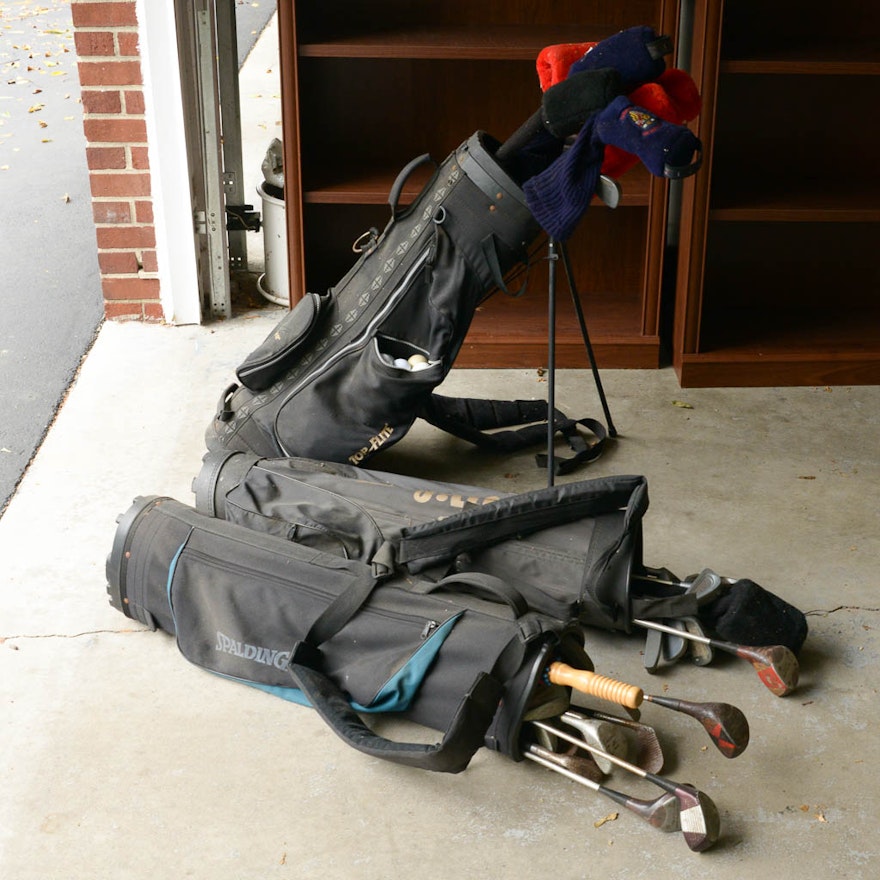 Assortment of Golf Clubs and Bags