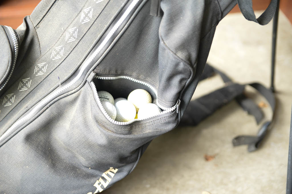 Assortment of Golf Clubs and Bags