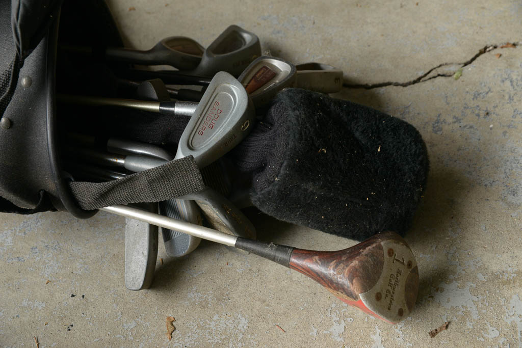 Assortment of Golf Clubs and Bags