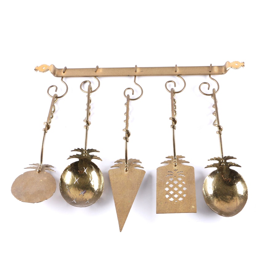 Brass Serving Utensils and Wall Rack