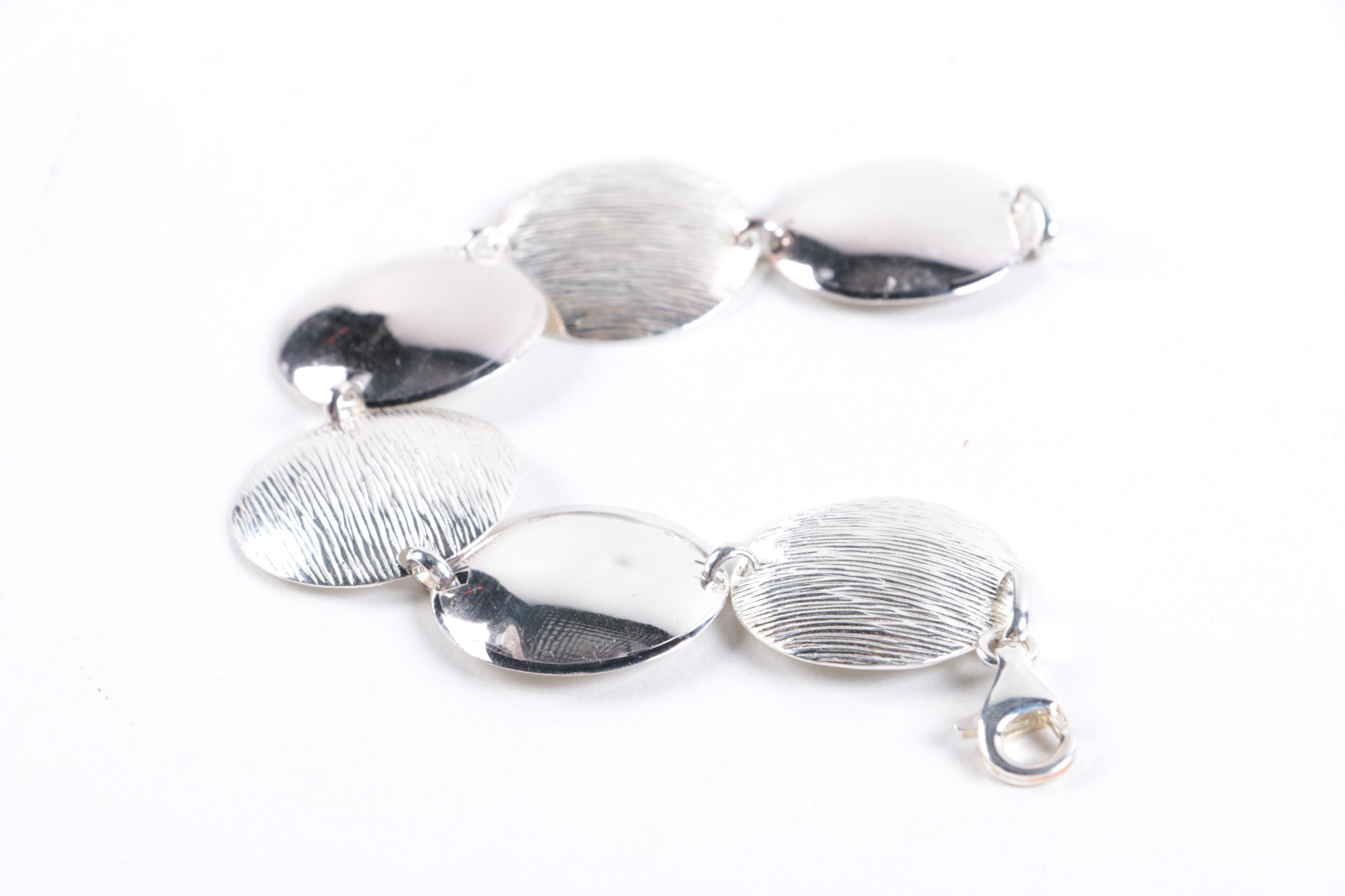 Sterling Silver Jewelry Including a Black Onyx Ring