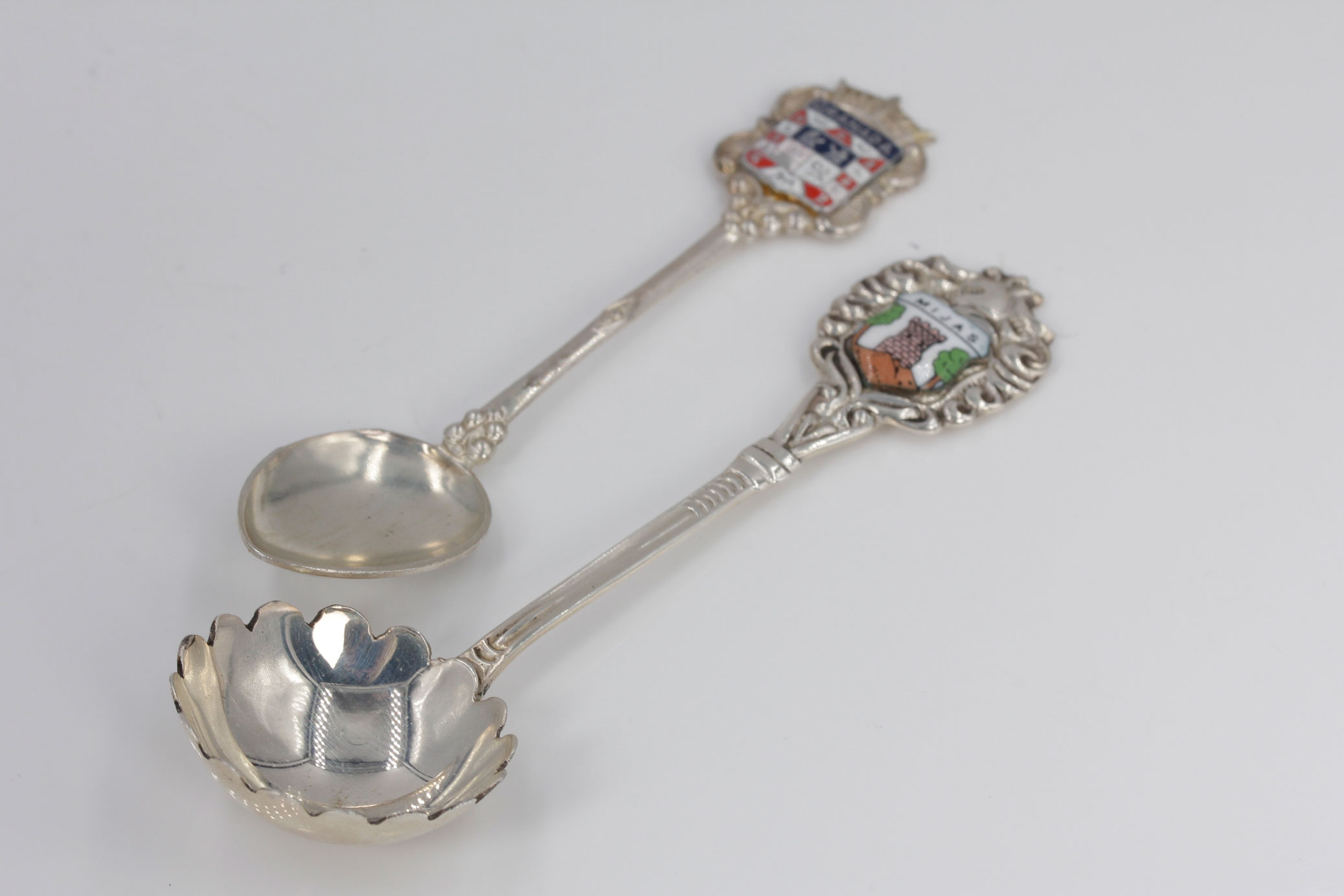 Two Sterling Silver and Enamel Collector Spoons