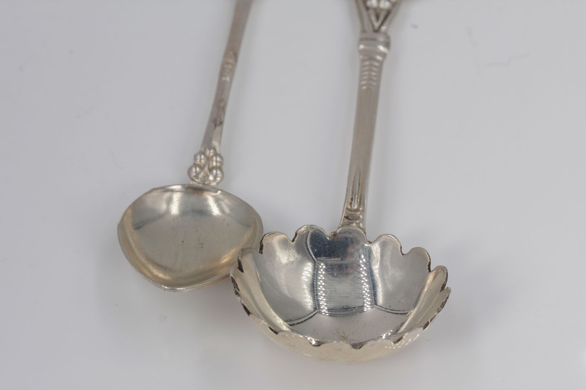 Two Sterling Silver and Enamel Collector Spoons