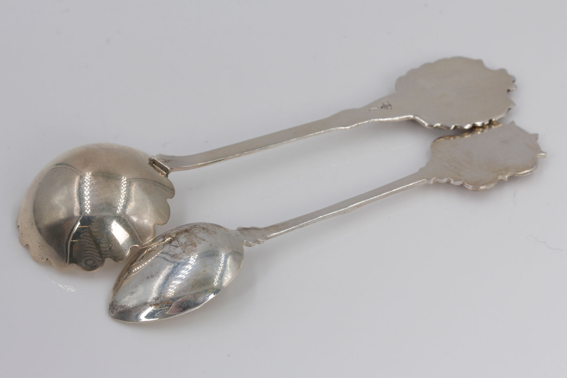 Two Sterling Silver and Enamel Collector Spoons
