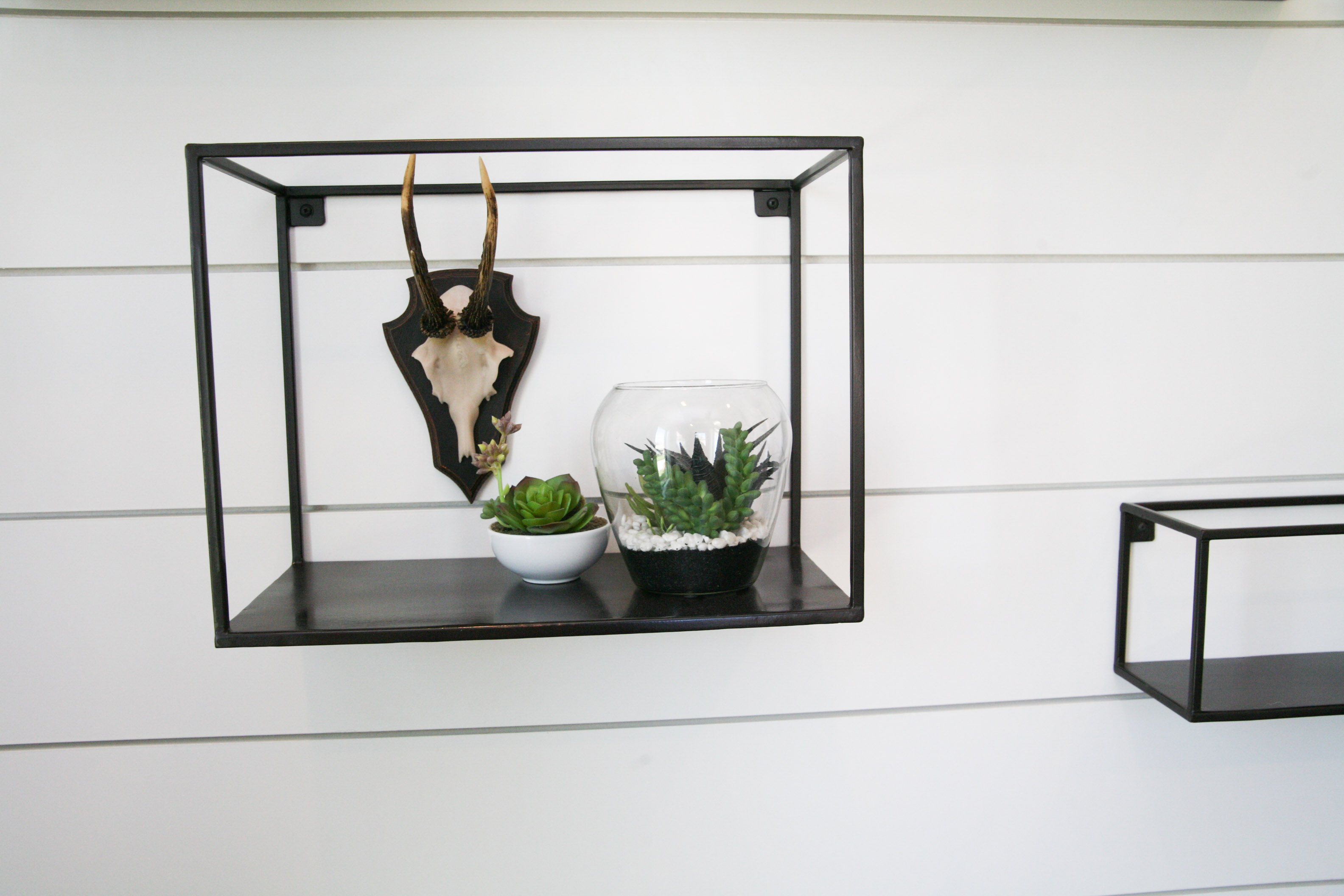 Collection of Metal Shelving With Various Home Decor