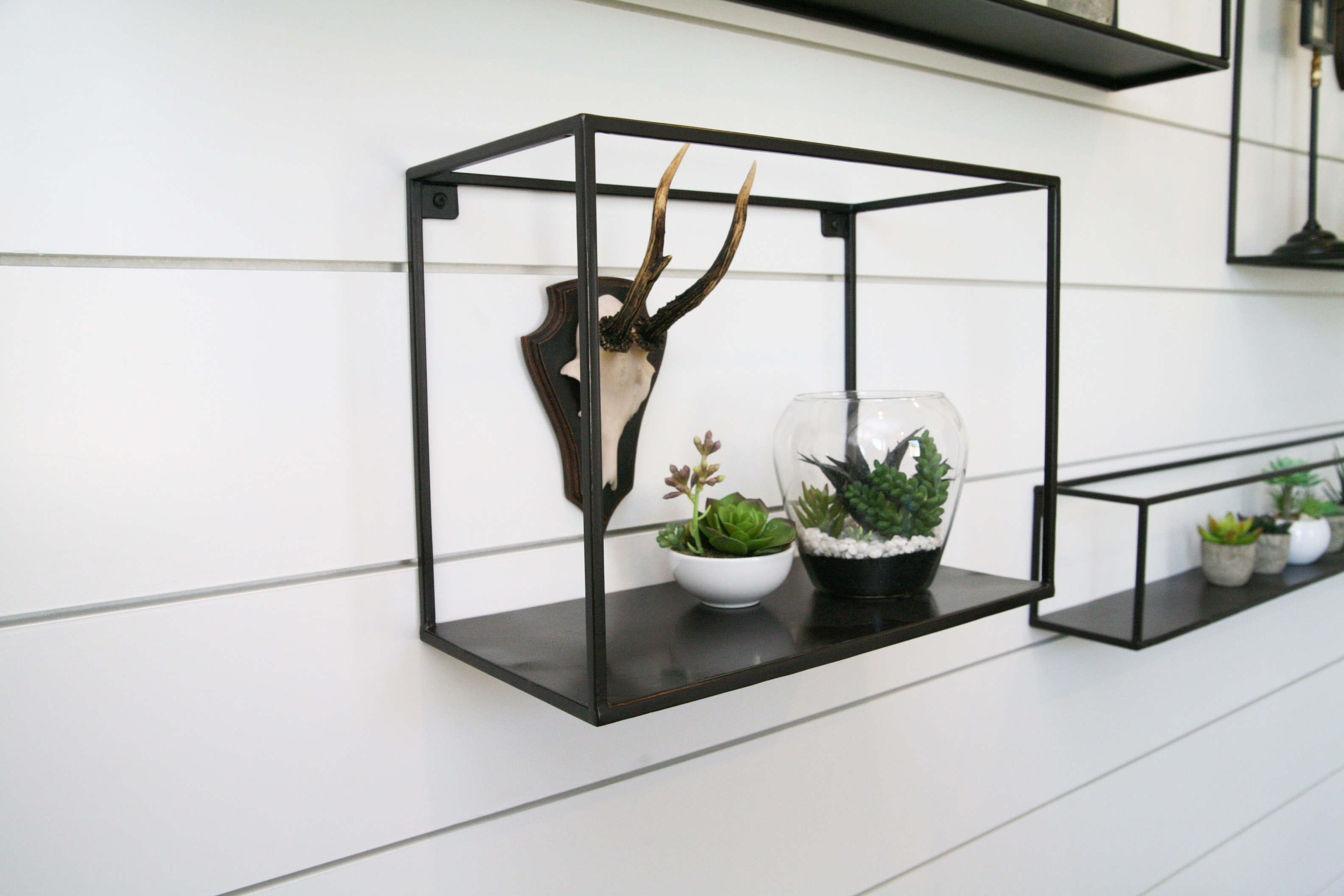 Collection of Metal Shelving With Various Home Decor