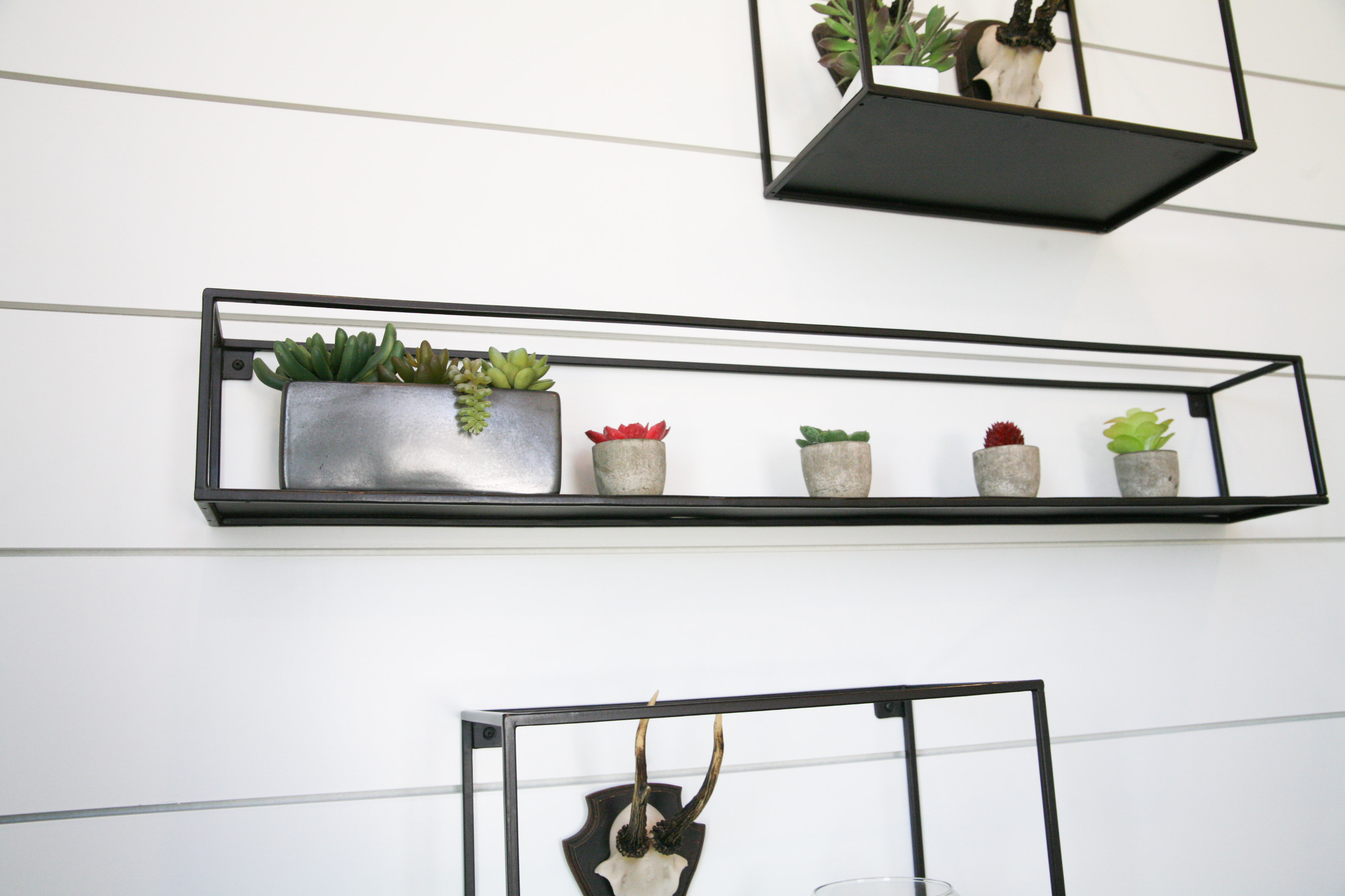 Collection of Metal Shelving With Various Home Decor