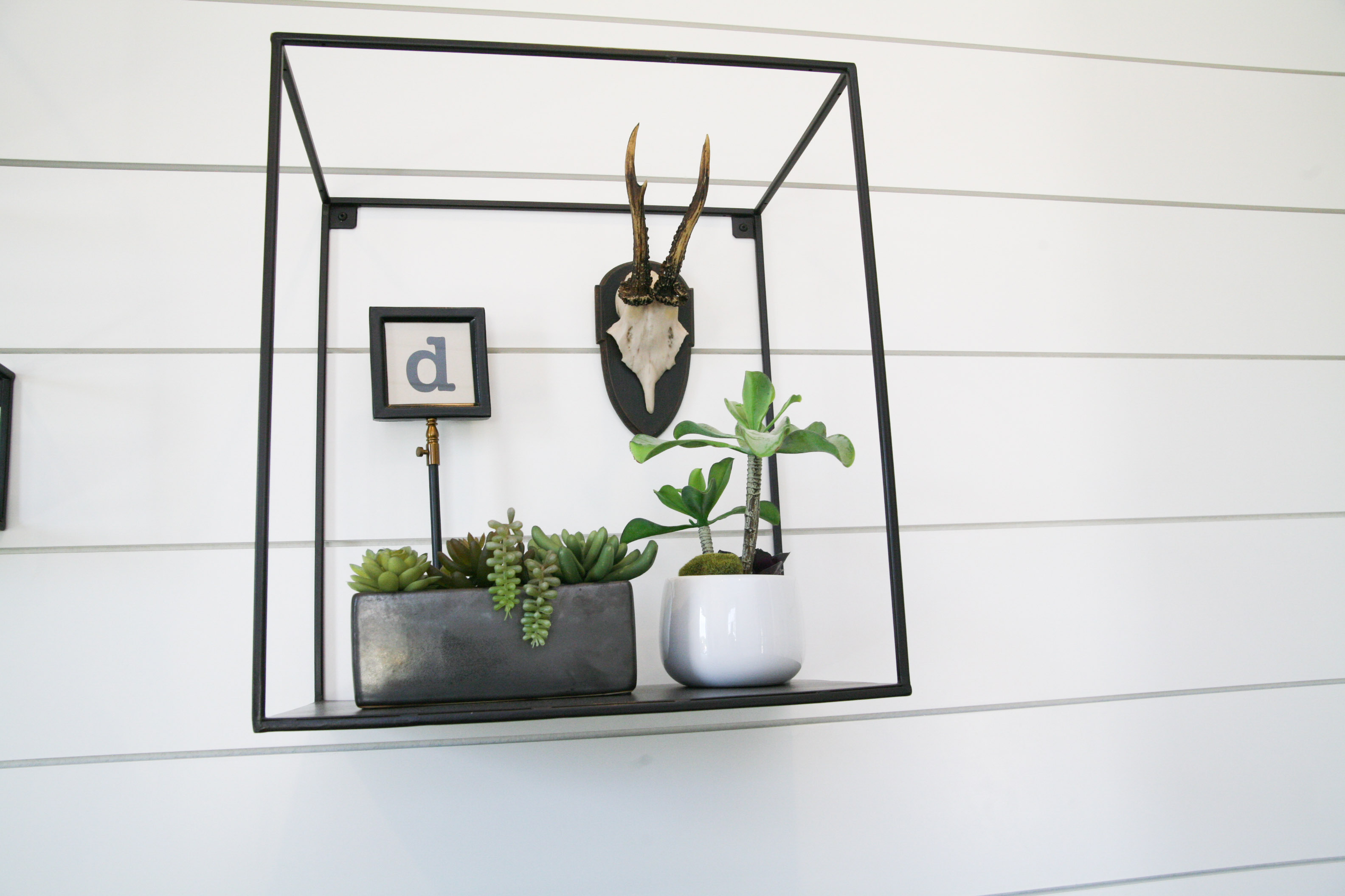 Collection of Metal Shelving With Various Home Decor