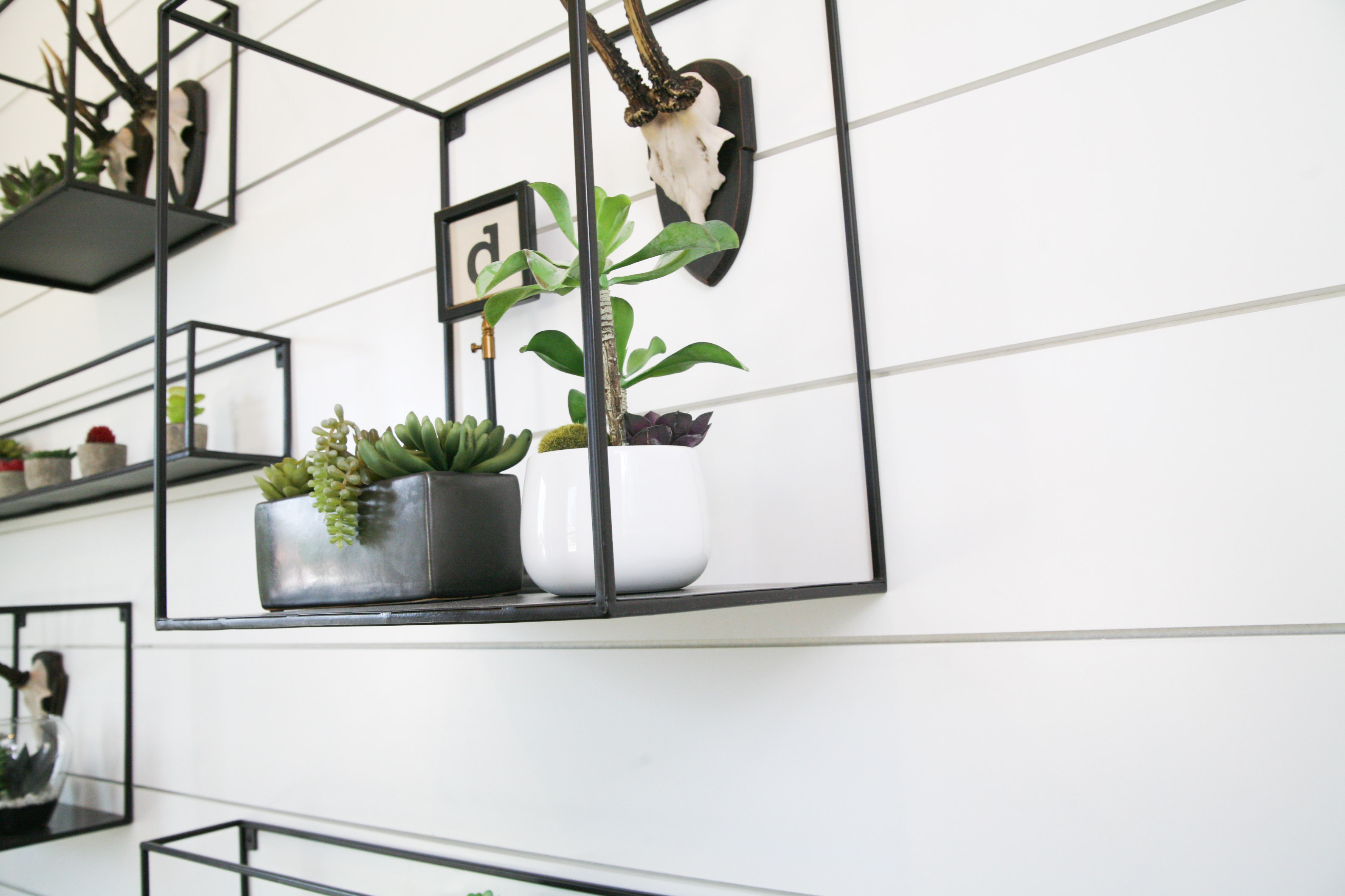 Collection of Metal Shelving With Various Home Decor