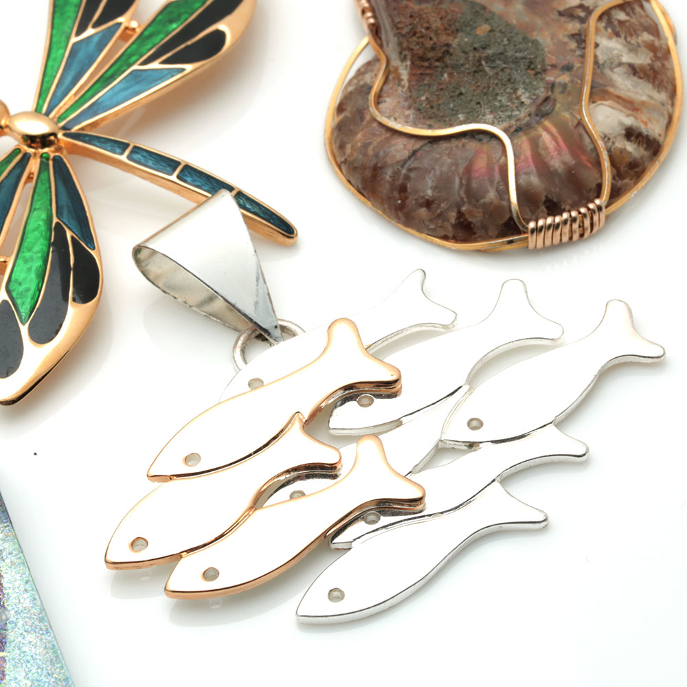 Assortment of Costume Jewelry Including Two Sterling Silver Charms