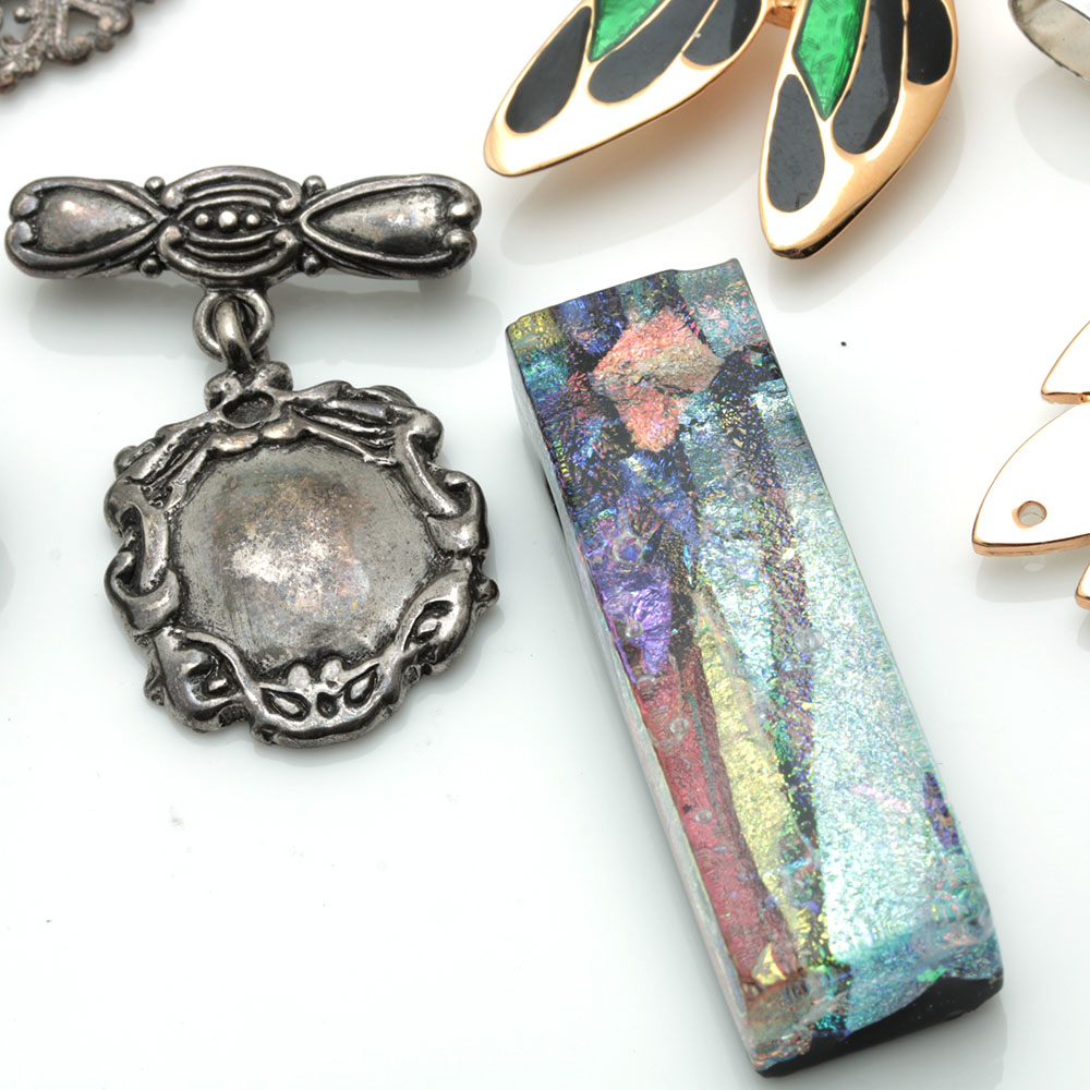 Assortment of Costume Jewelry Including Two Sterling Silver Charms