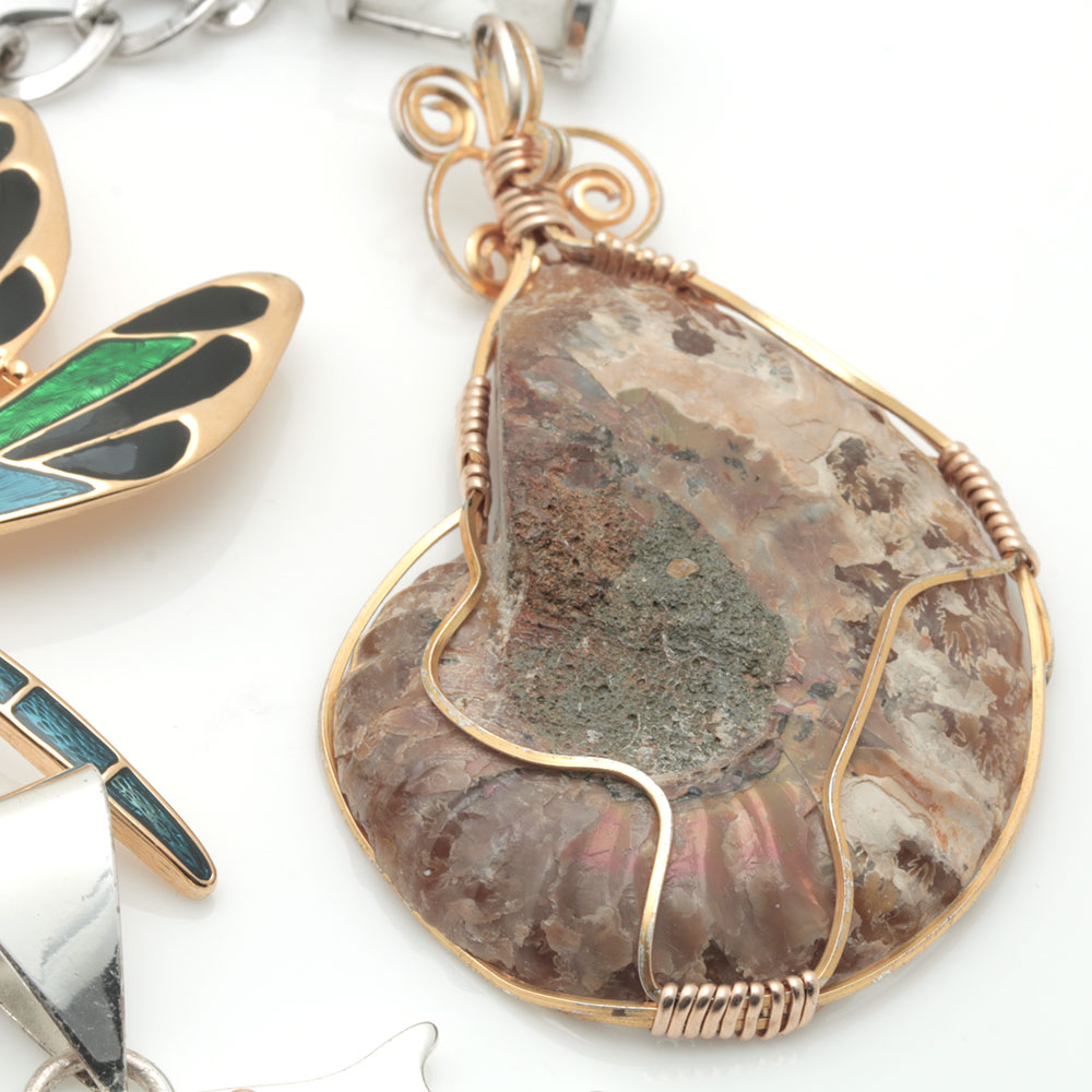 Assortment of Costume Jewelry Including Two Sterling Silver Charms