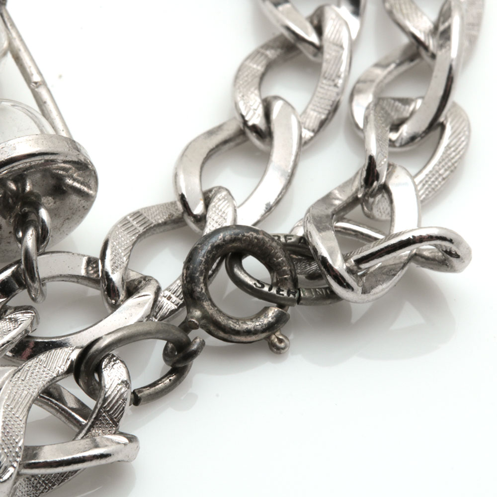 Assortment of Costume Jewelry Including Two Sterling Silver Charms