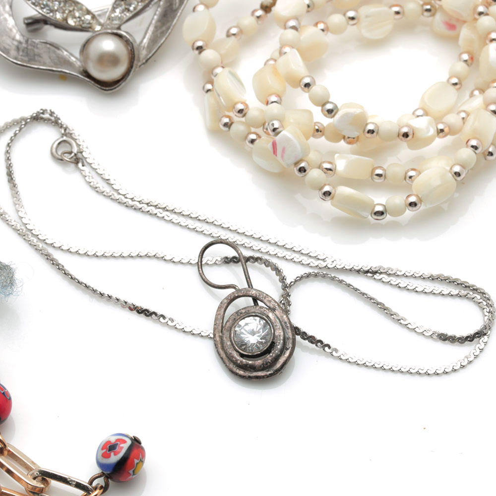 Colorful Assortment of Jewelry Featuring Sterling Silver, Shell, Rhinestones, and Imitation Millefiori