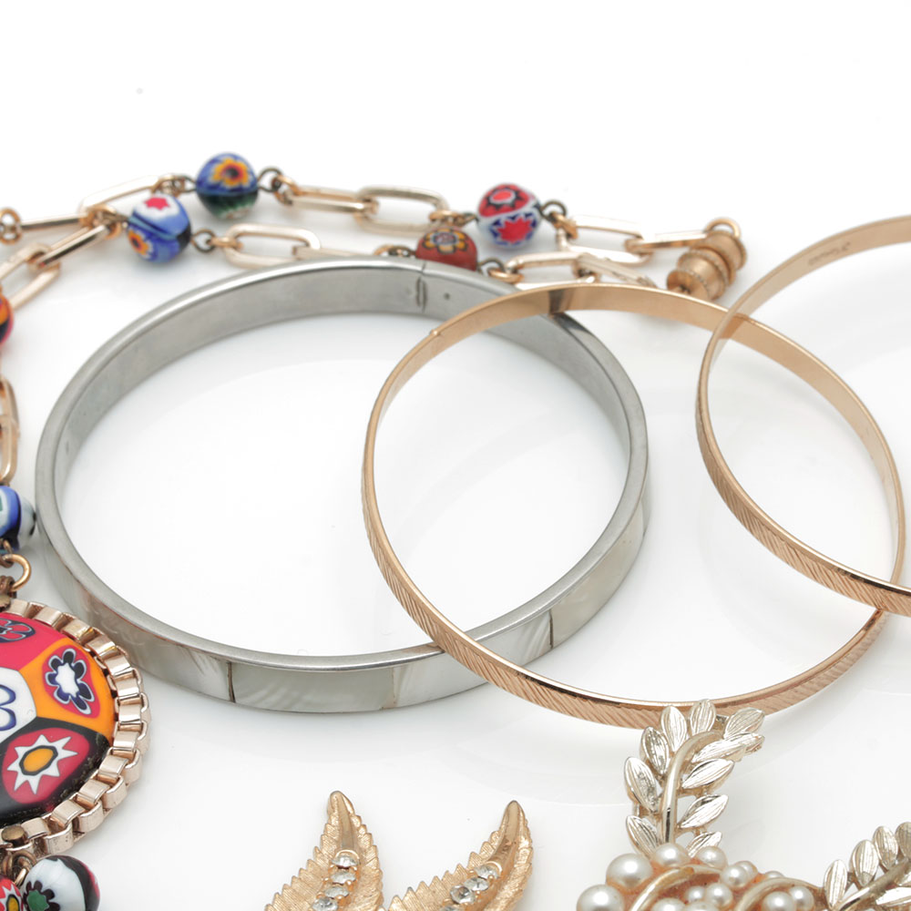 Colorful Assortment of Jewelry Featuring Sterling Silver, Shell, Rhinestones, and Imitation Millefiori