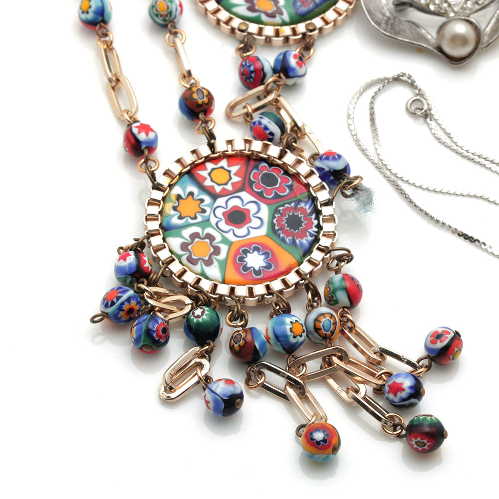 Colorful Assortment of Jewelry Featuring Sterling Silver, Shell, Rhinestones, and Imitation Millefiori