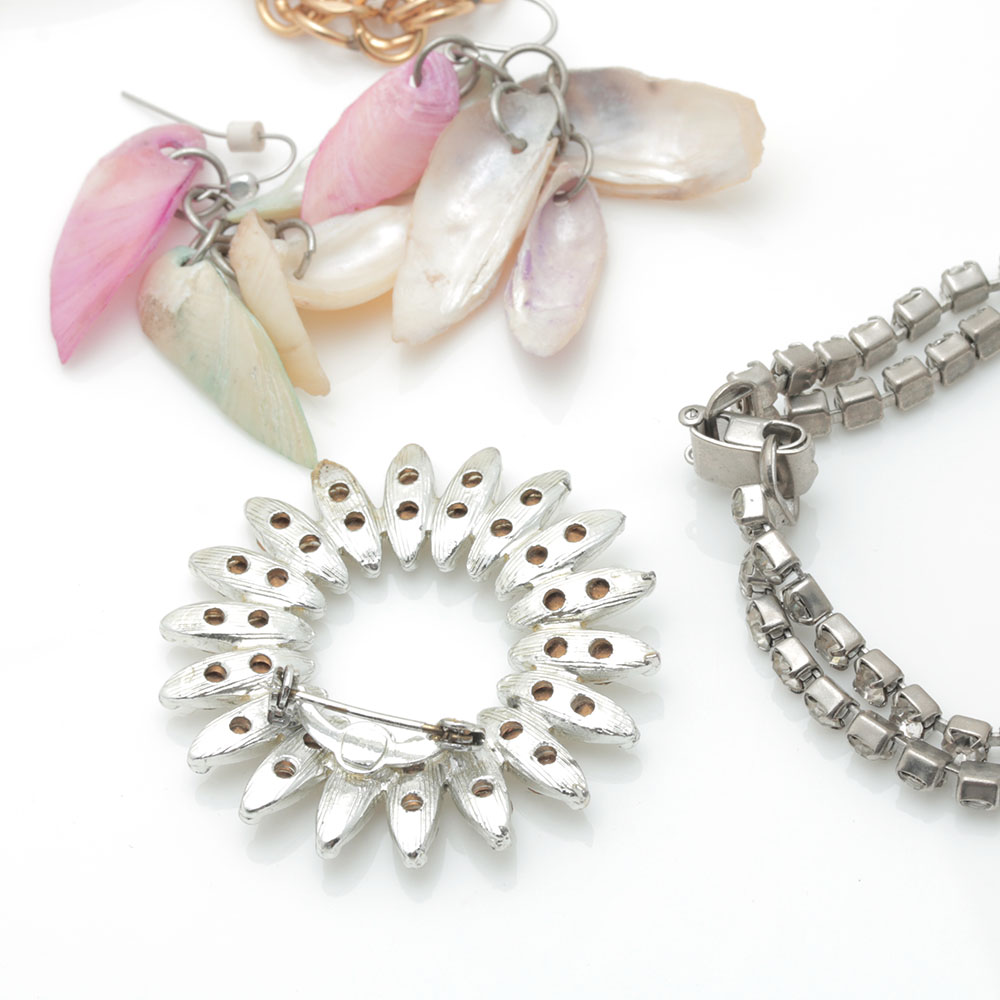 Colorful Assortment of Jewelry Featuring Sterling Silver, Shell, Rhinestones, and Imitation Millefiori
