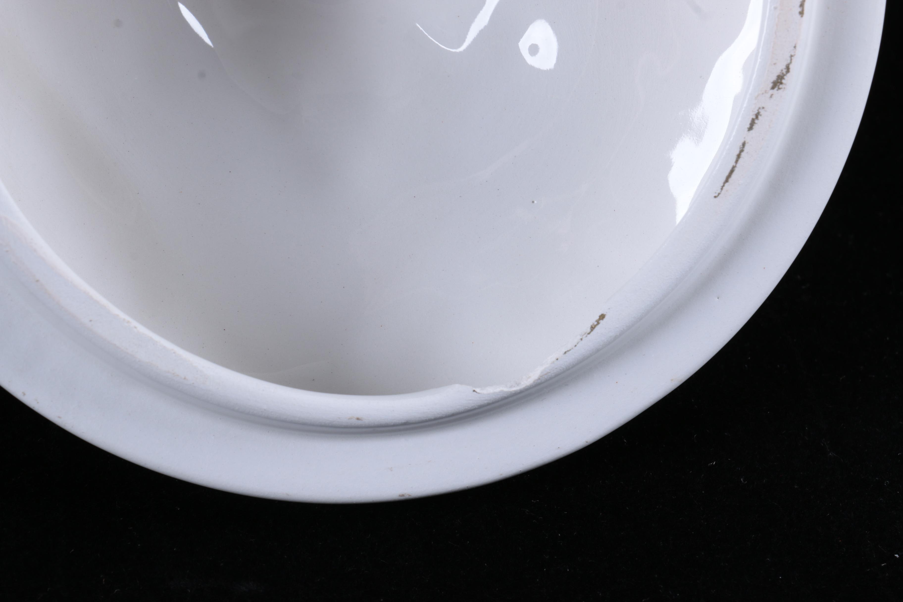 Four Pieces of Embossed White Ceramic Serveware