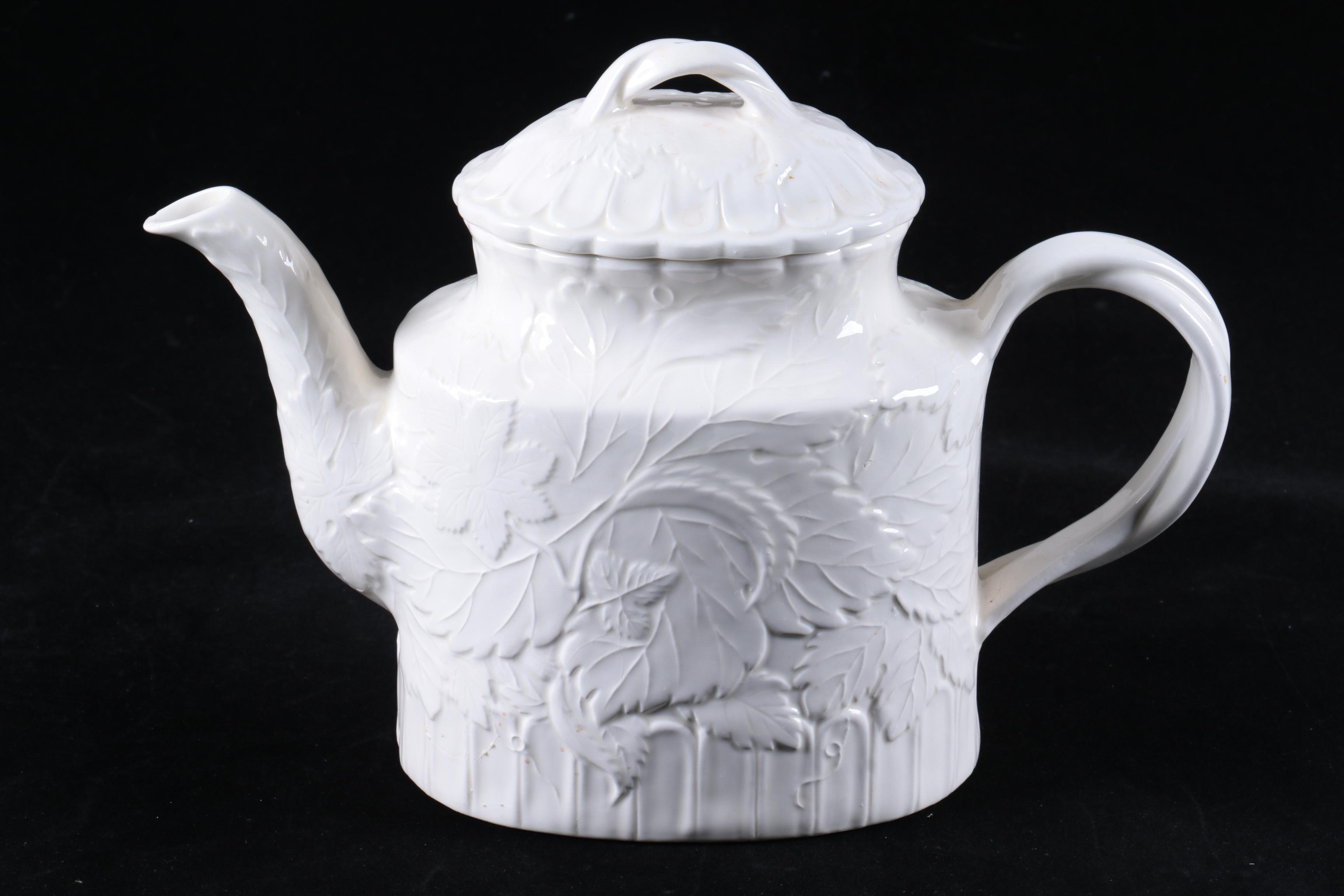 Four Pieces of Embossed White Ceramic Serveware