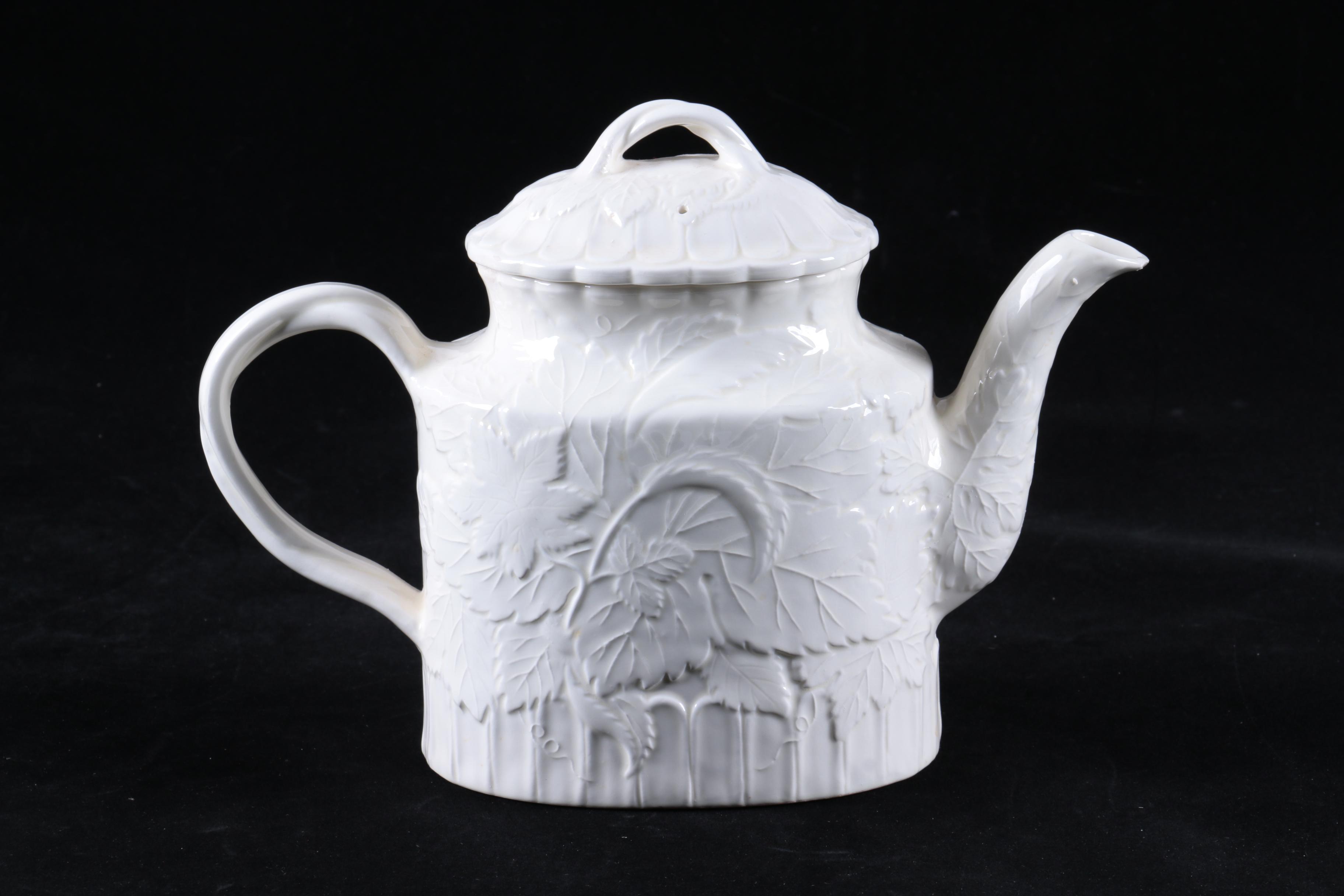 Four Pieces of Embossed White Ceramic Serveware