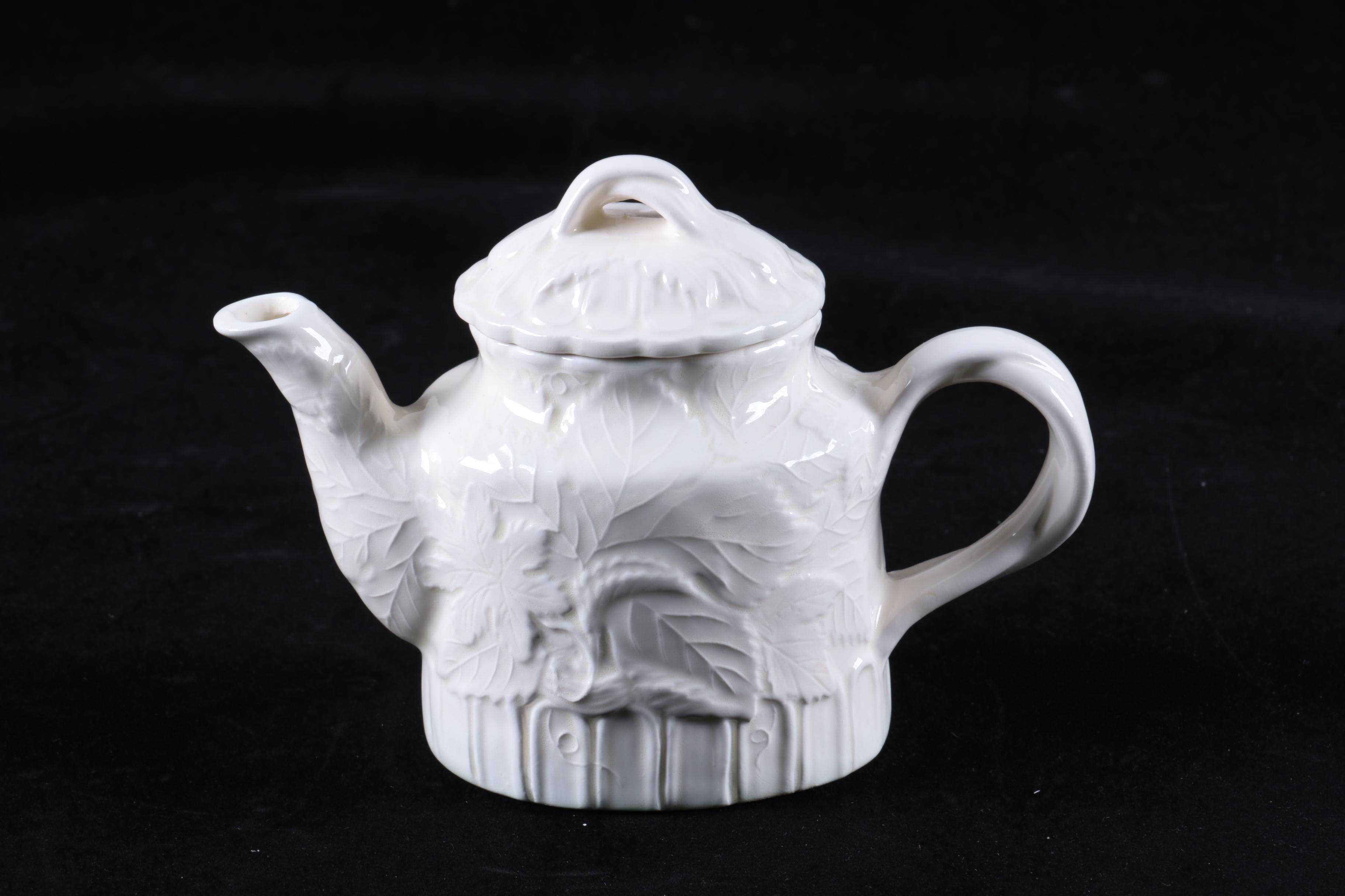 Four Pieces of Embossed White Ceramic Serveware