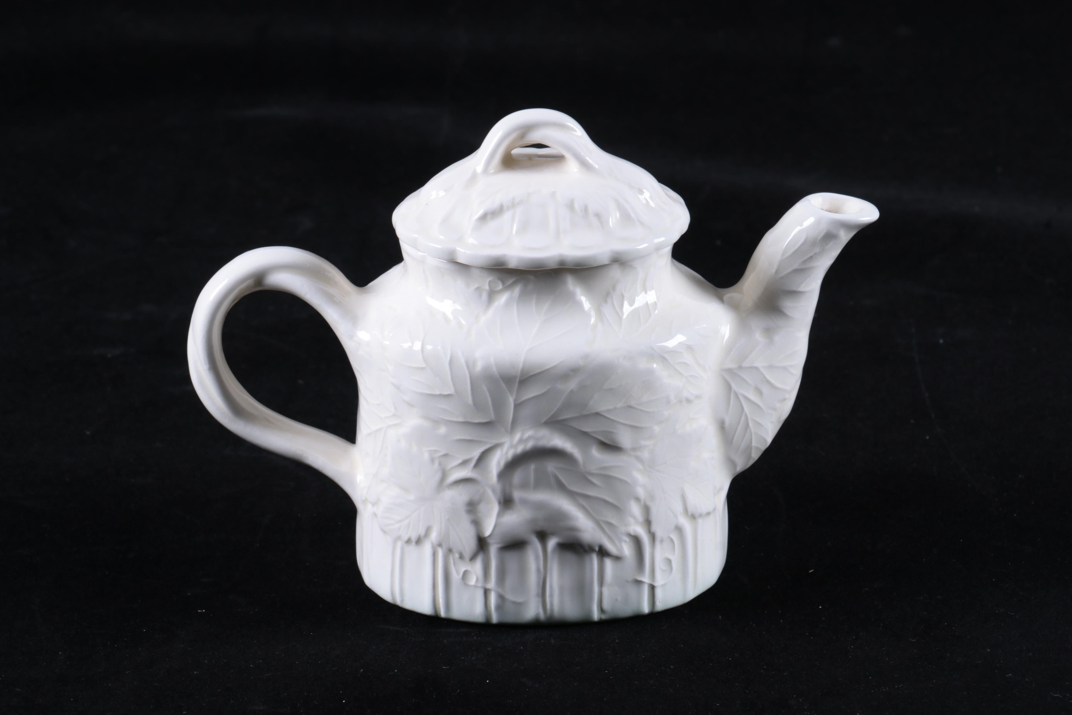 Four Pieces of Embossed White Ceramic Serveware