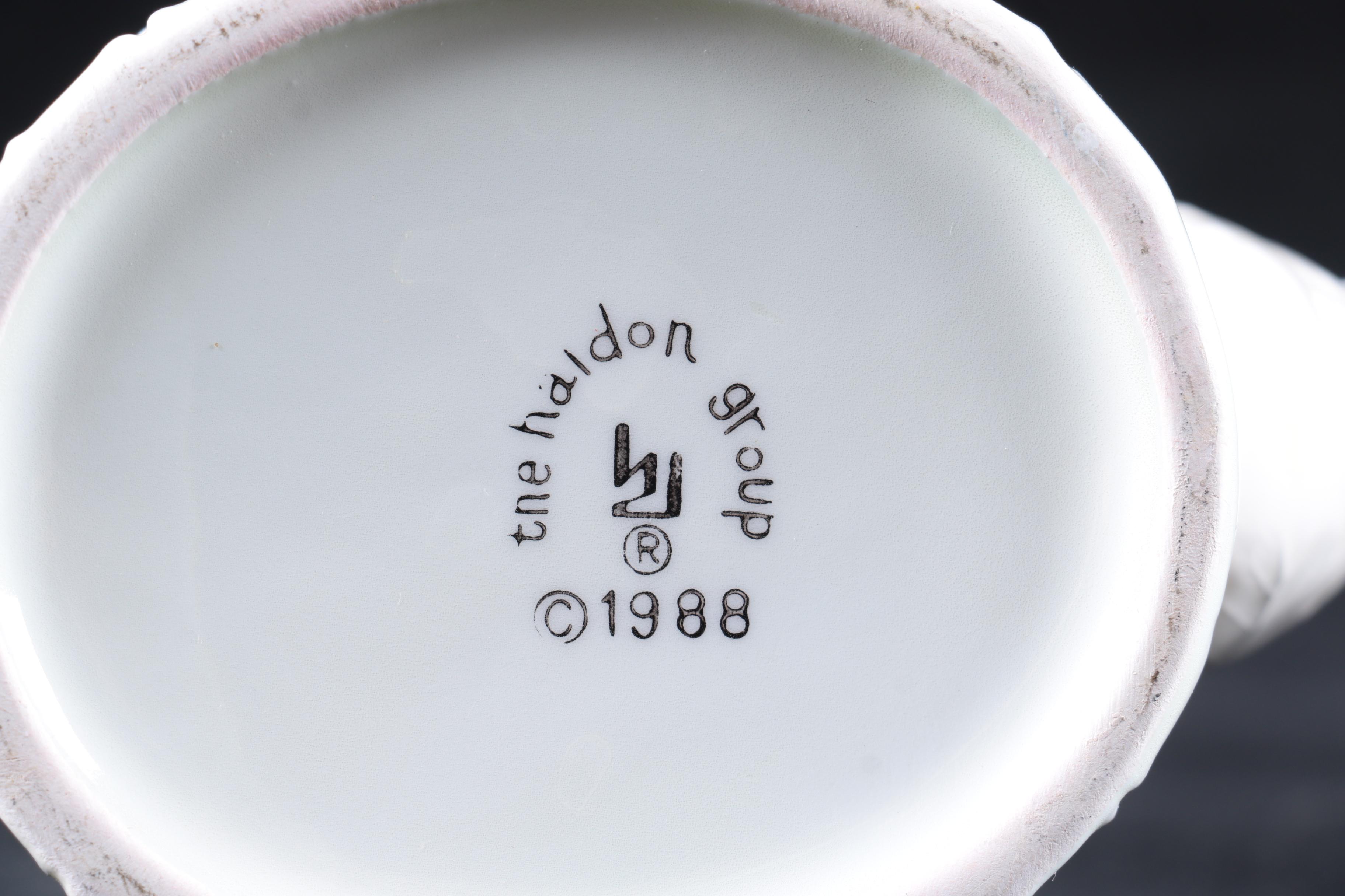 Four Pieces of Embossed White Ceramic Serveware