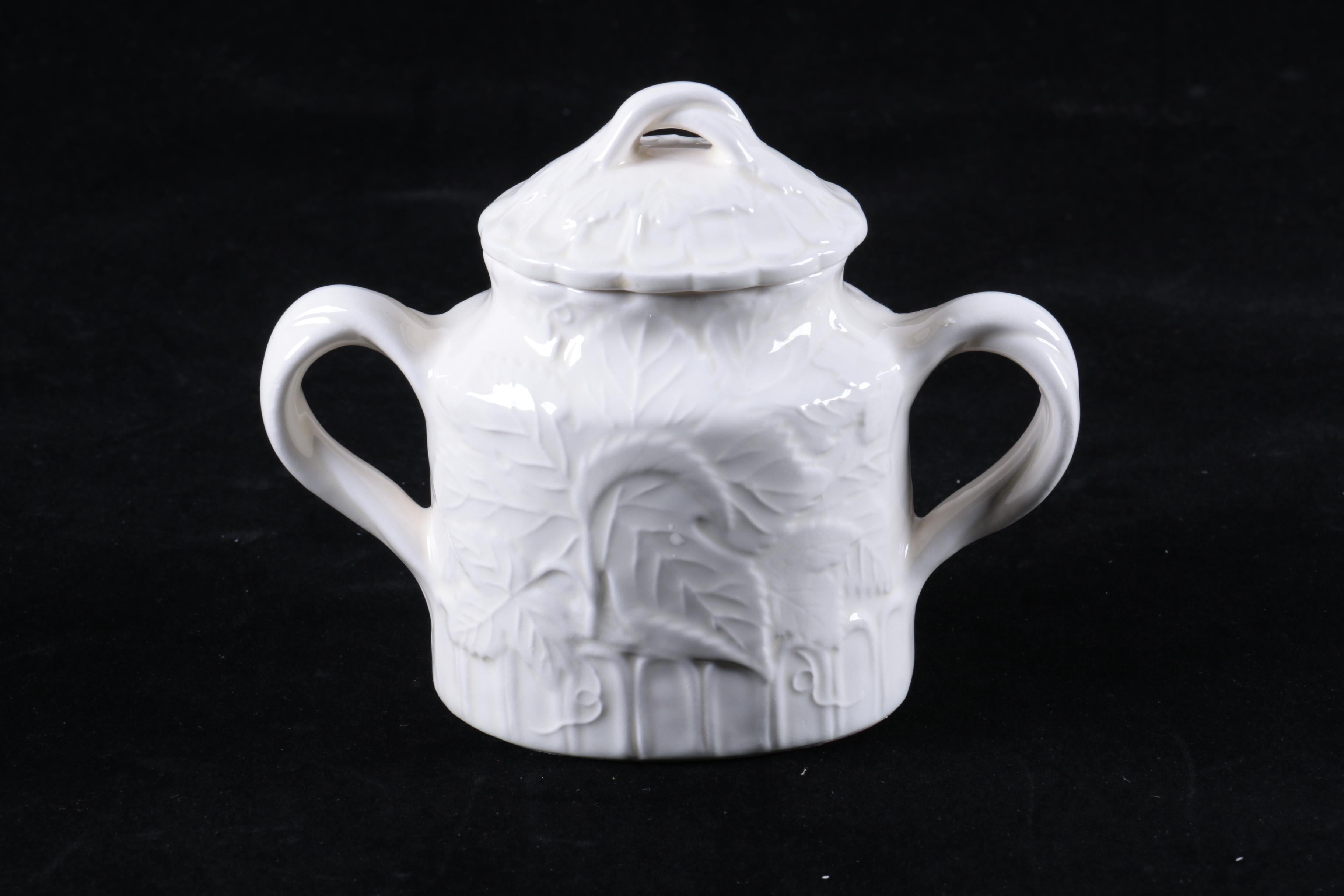 Four Pieces of Embossed White Ceramic Serveware