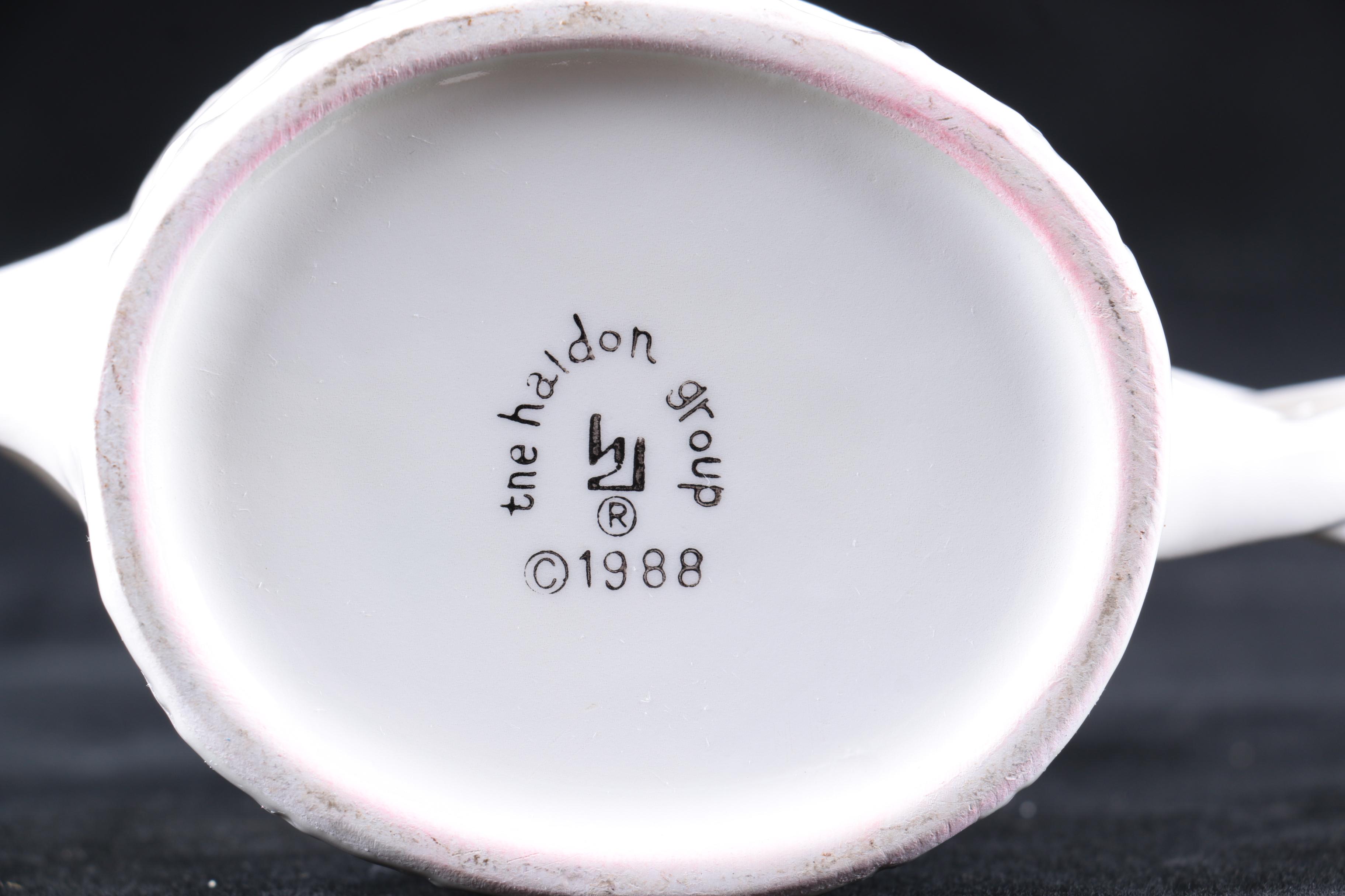 Four Pieces of Embossed White Ceramic Serveware