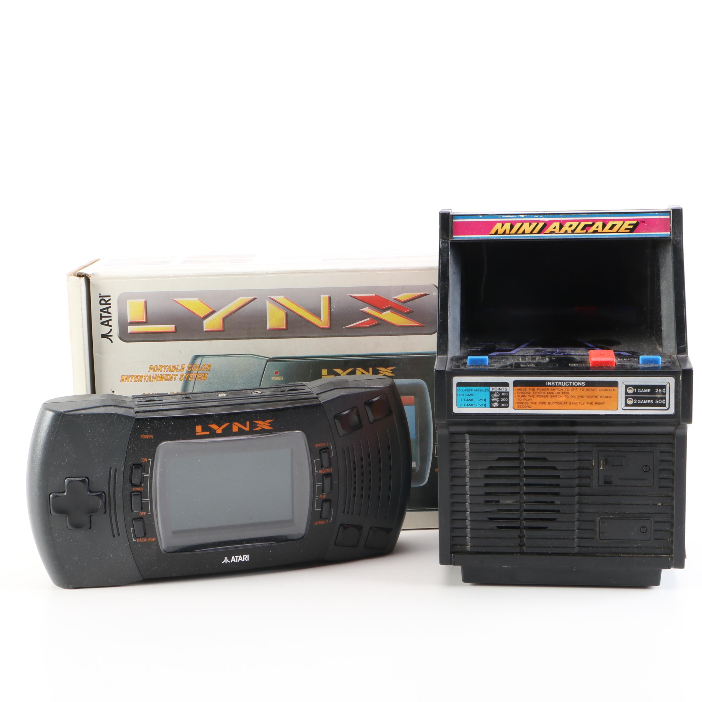 Atari Lynx with Games and a Tomy "Cosmic Clash" Mini Arcade