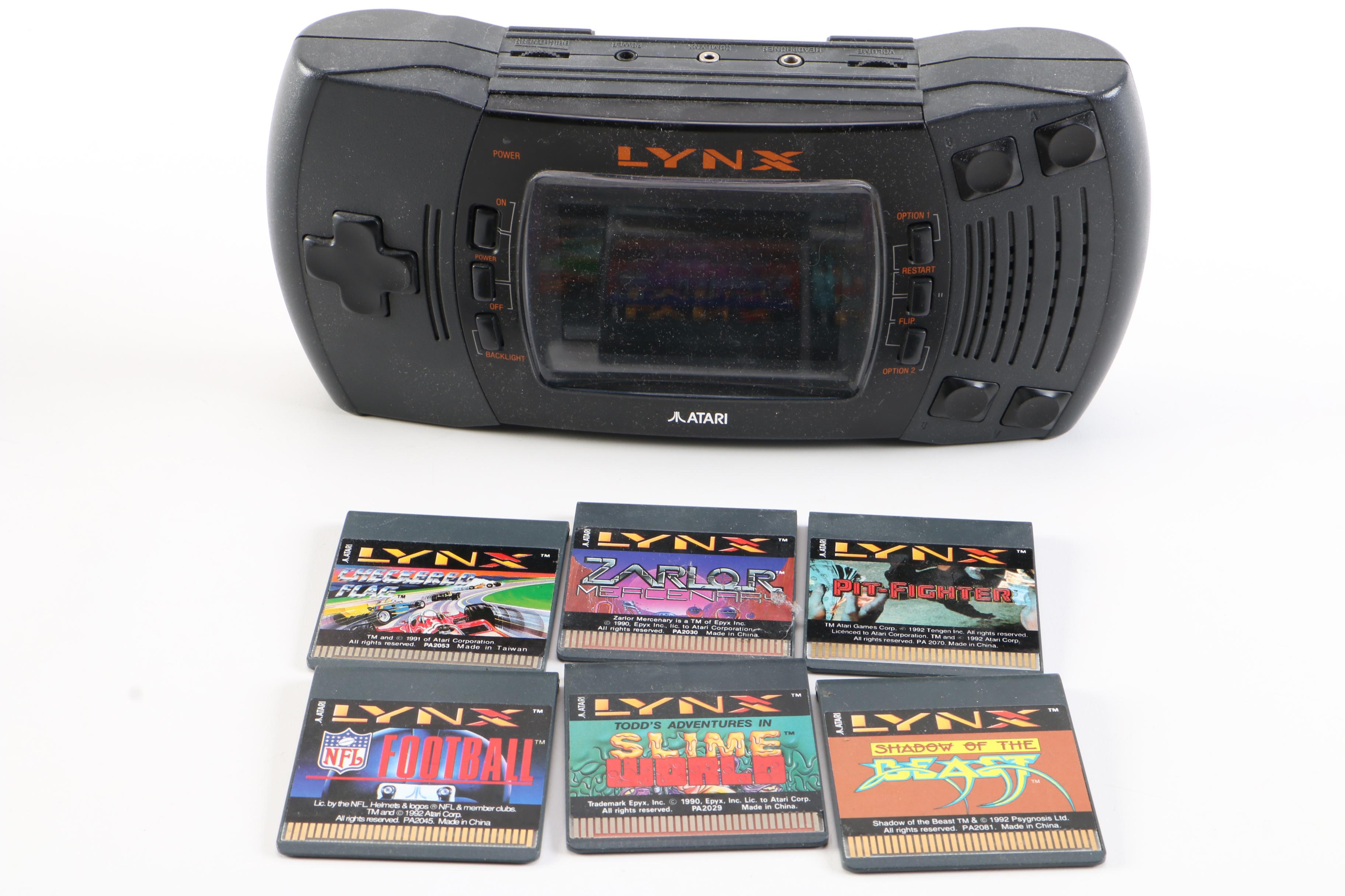 Atari Lynx with Games and a Tomy "Cosmic Clash" Mini Arcade