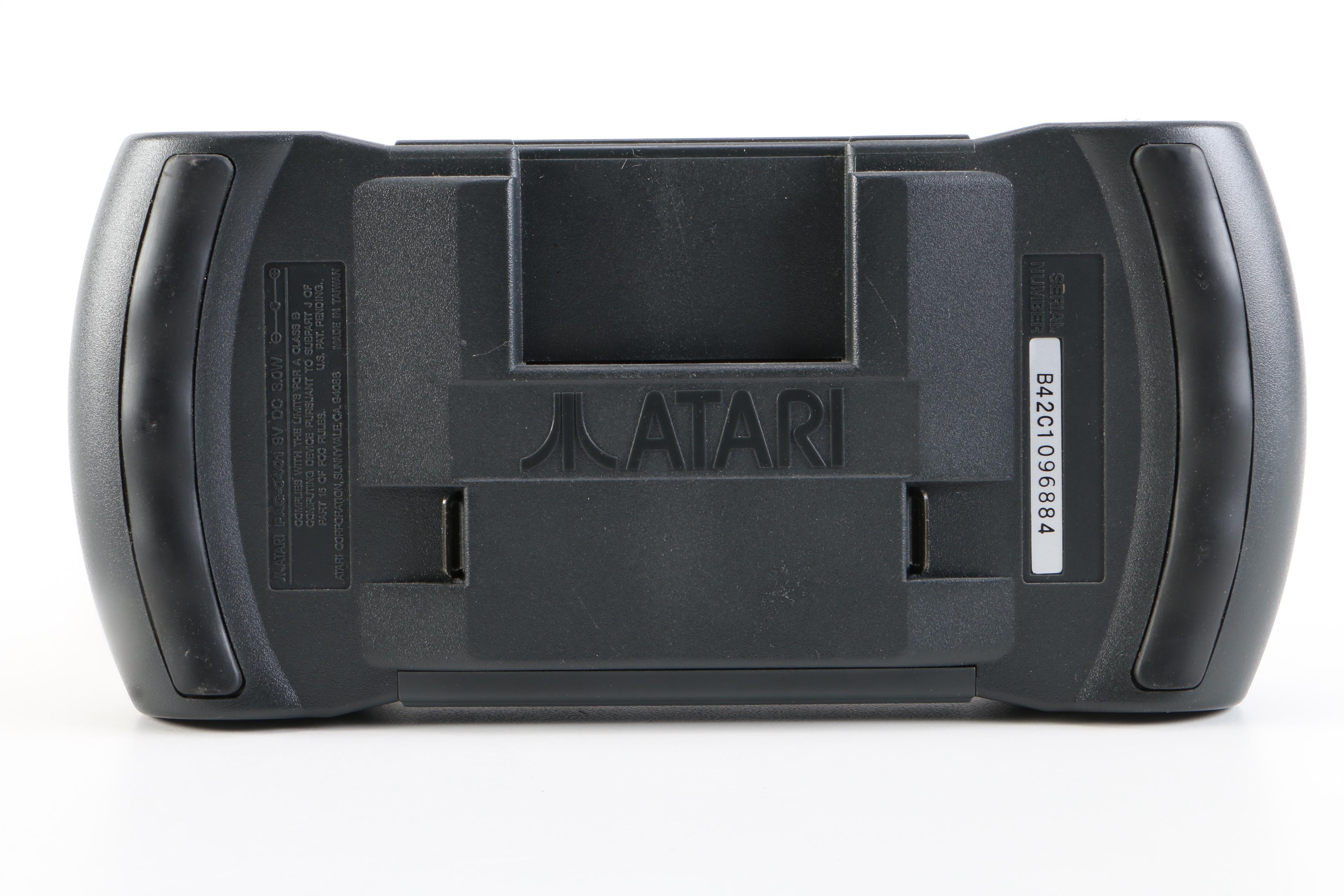 Atari Lynx with Games and a Tomy "Cosmic Clash" Mini Arcade