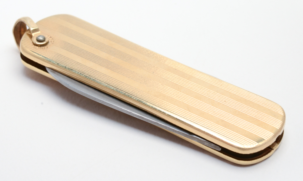 Sterling Silver Eagle Scott Ring and a Gold Tone Pocket Knife